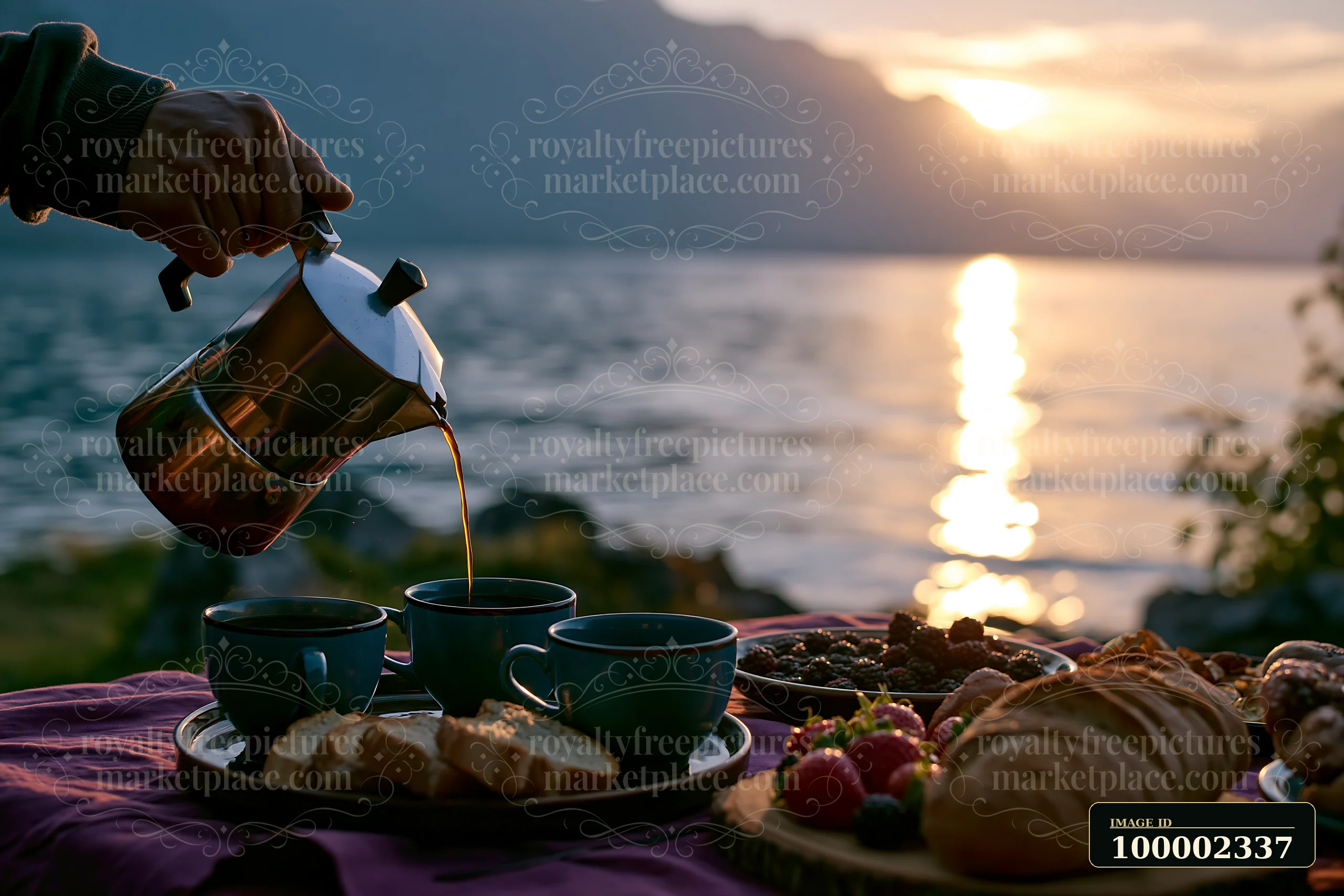A person pours coffee into cups as the sun sets over a lake.