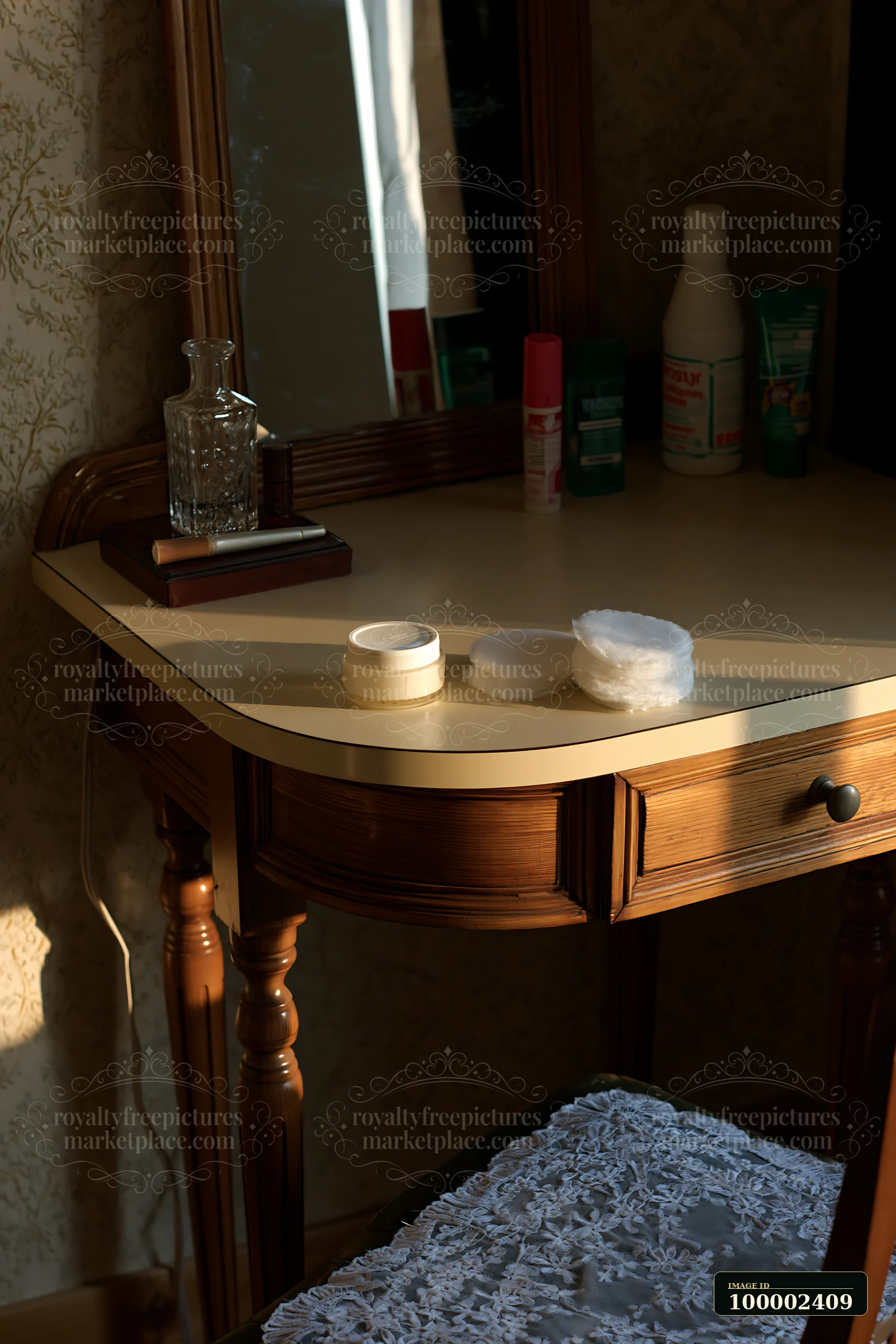 A cream dose is placed next to cotton pads on a wooden vanity.