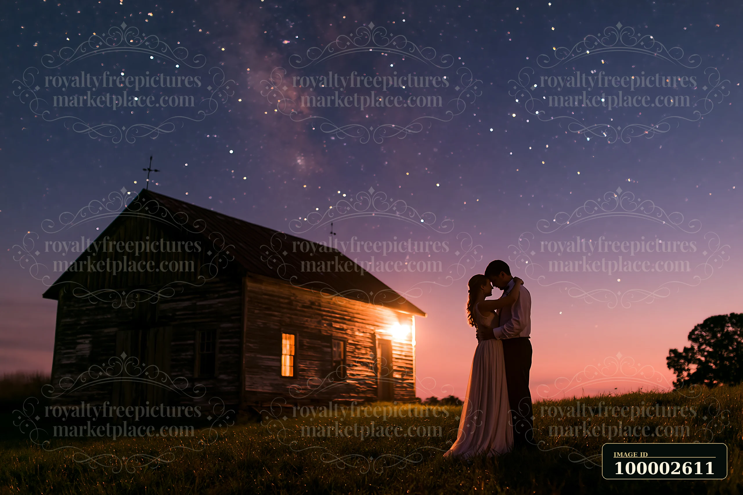A couple dances under stars outdoors near a rustic cabin, enjoying an intimate moment in a natural setting.