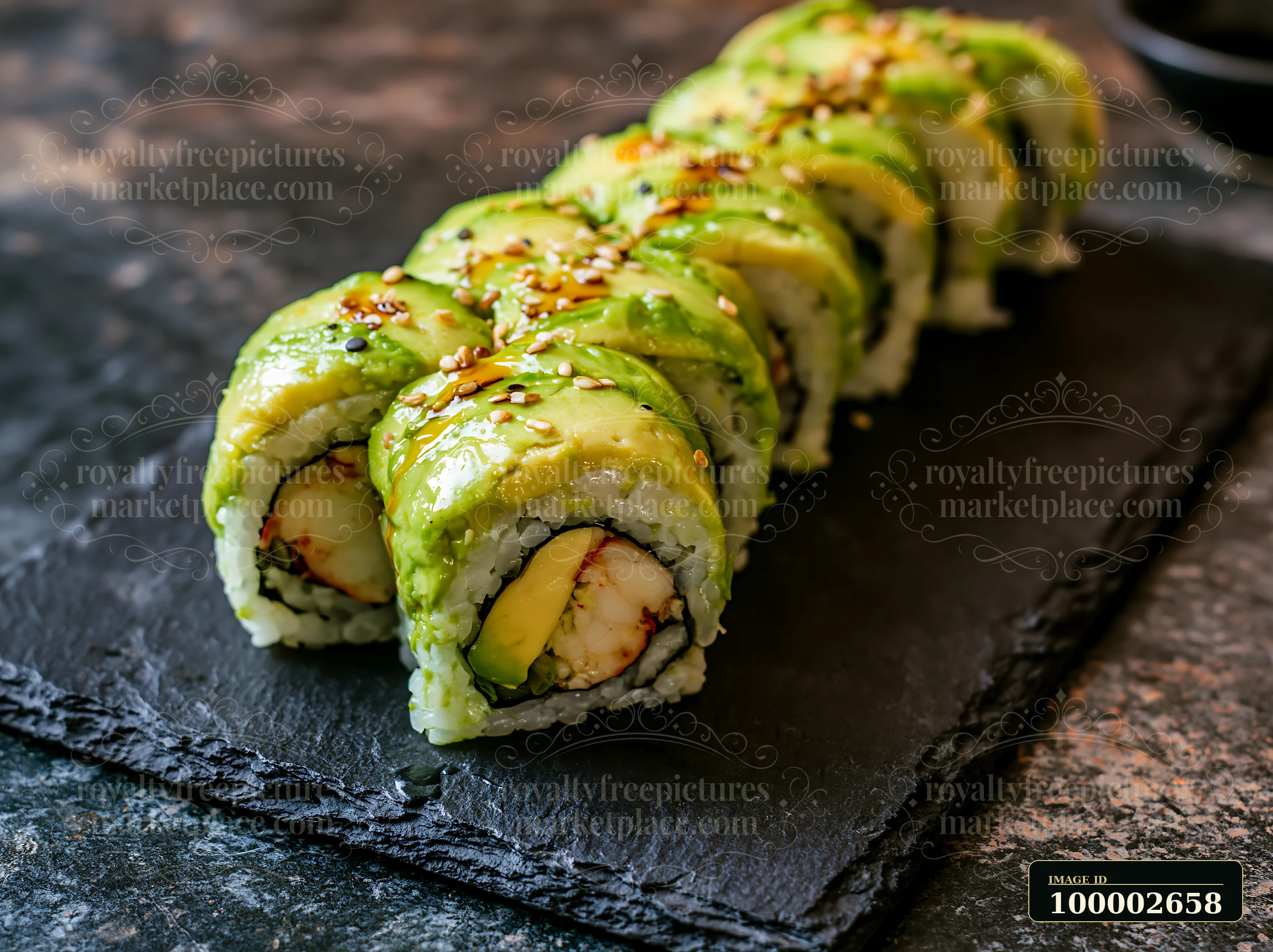 A dragon roll close-up shows sushi rolled with shrimp and avocado slices on a textured slate surface.
