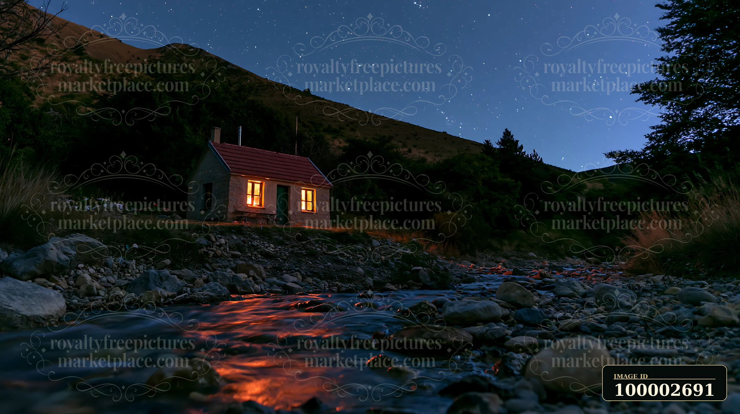 A small cabin sits beside a stream, illuminated by warm light from its windows, while a clear night sky filled with stars stretches above in a remote rural sett
