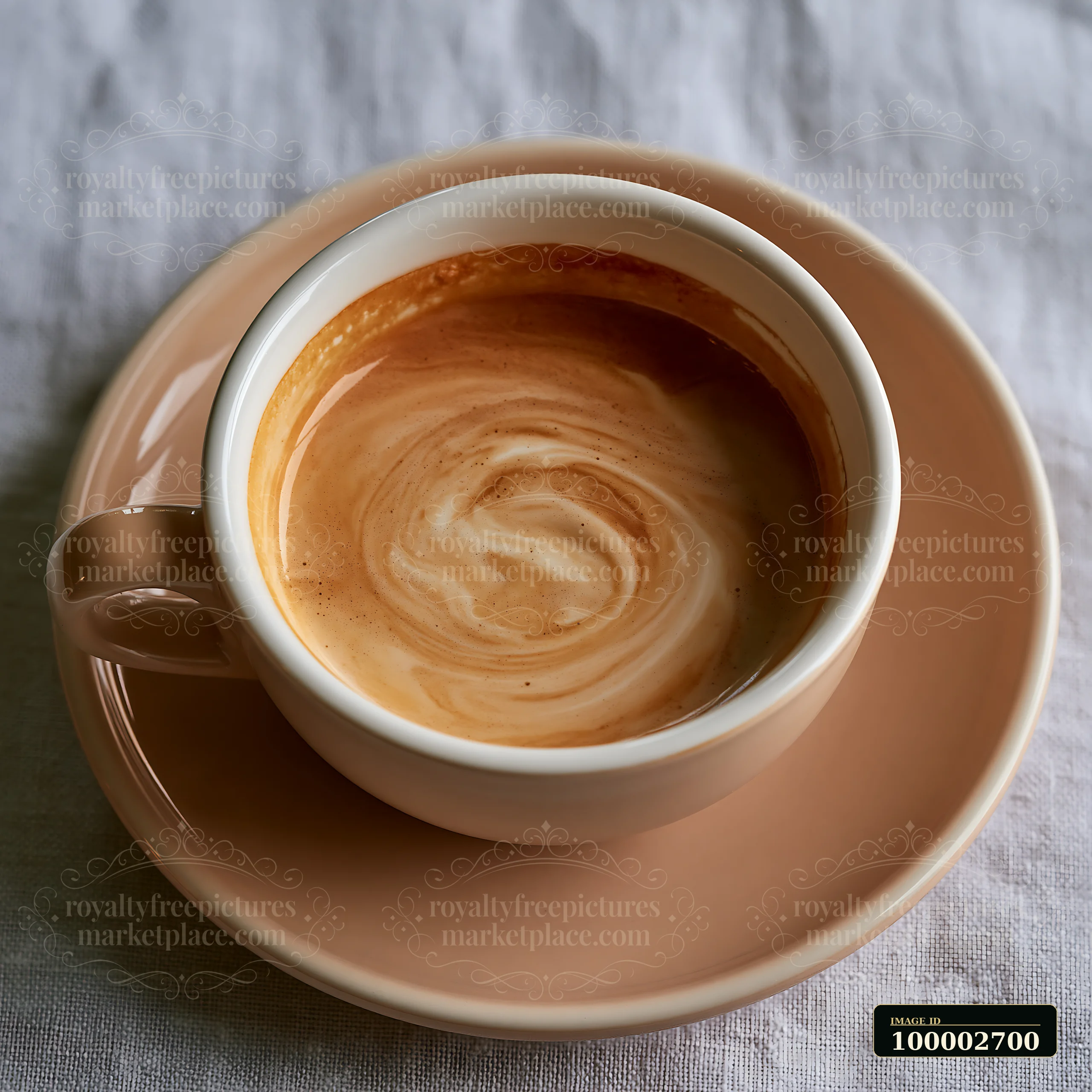 A cup holds a creamy beverage with smooth glossy texture, displaying a swirl of colors.