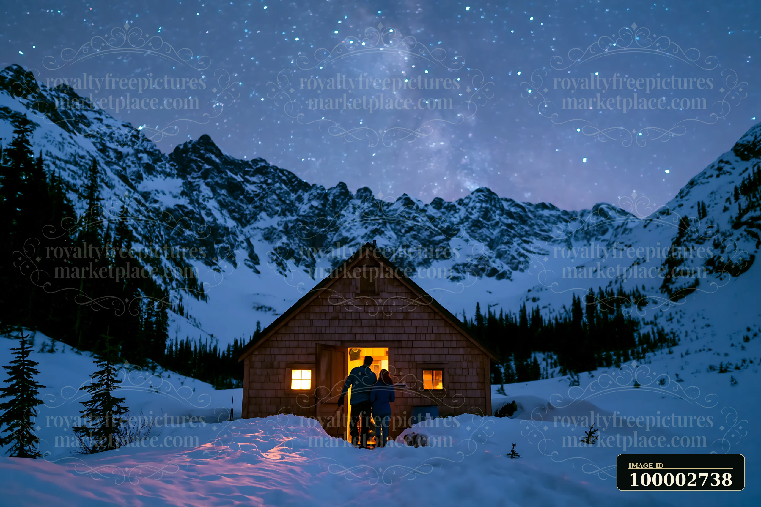 A couple stands together outside a cabin, surrounded by snow and mountains, admiring the starry sky.