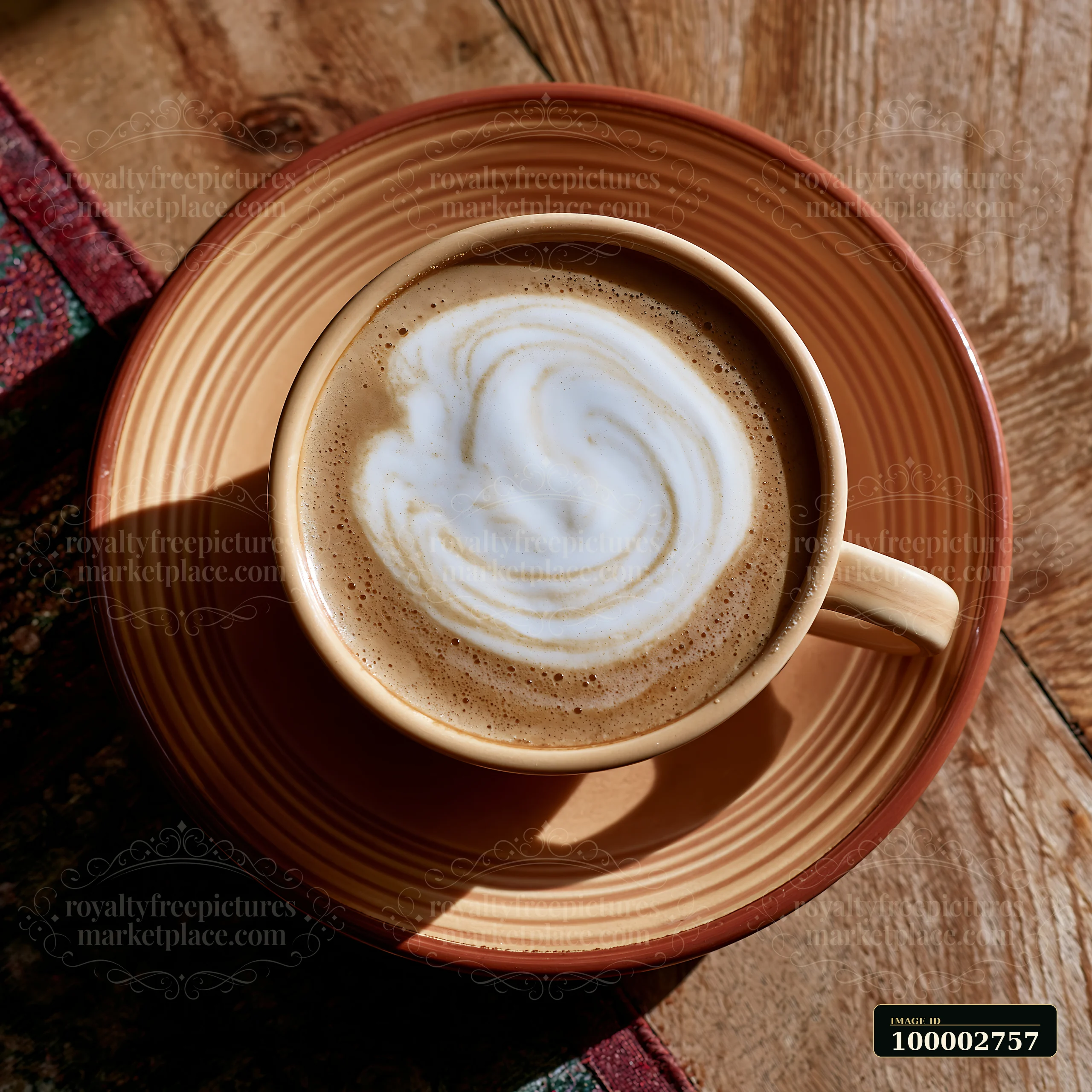 A ceramic cup filled with coffee shows a cream dose with smooth glossy texture swirling on top.