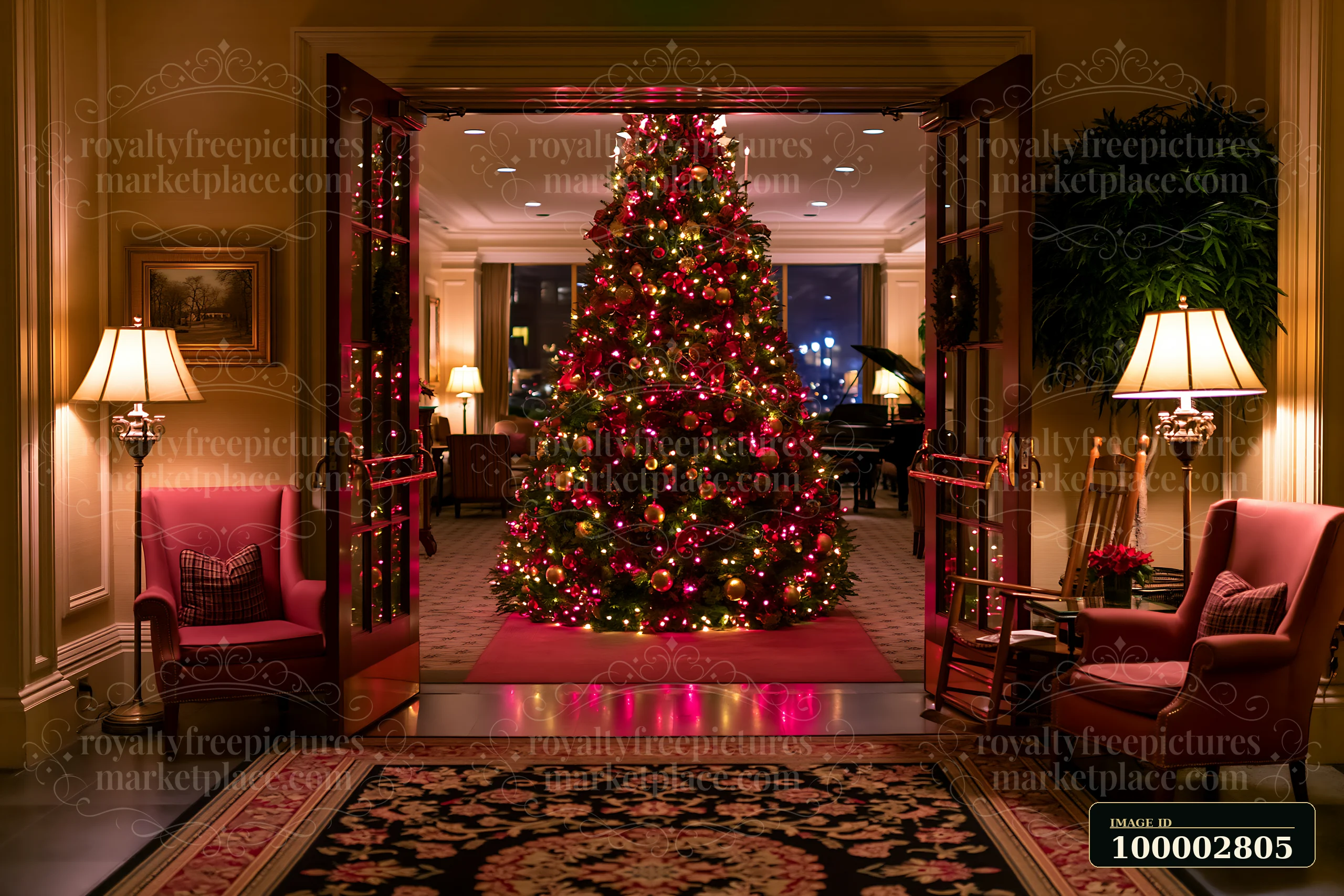 A large Christmas tree stands in a hotel lobby, adorned with lights and decorations.
