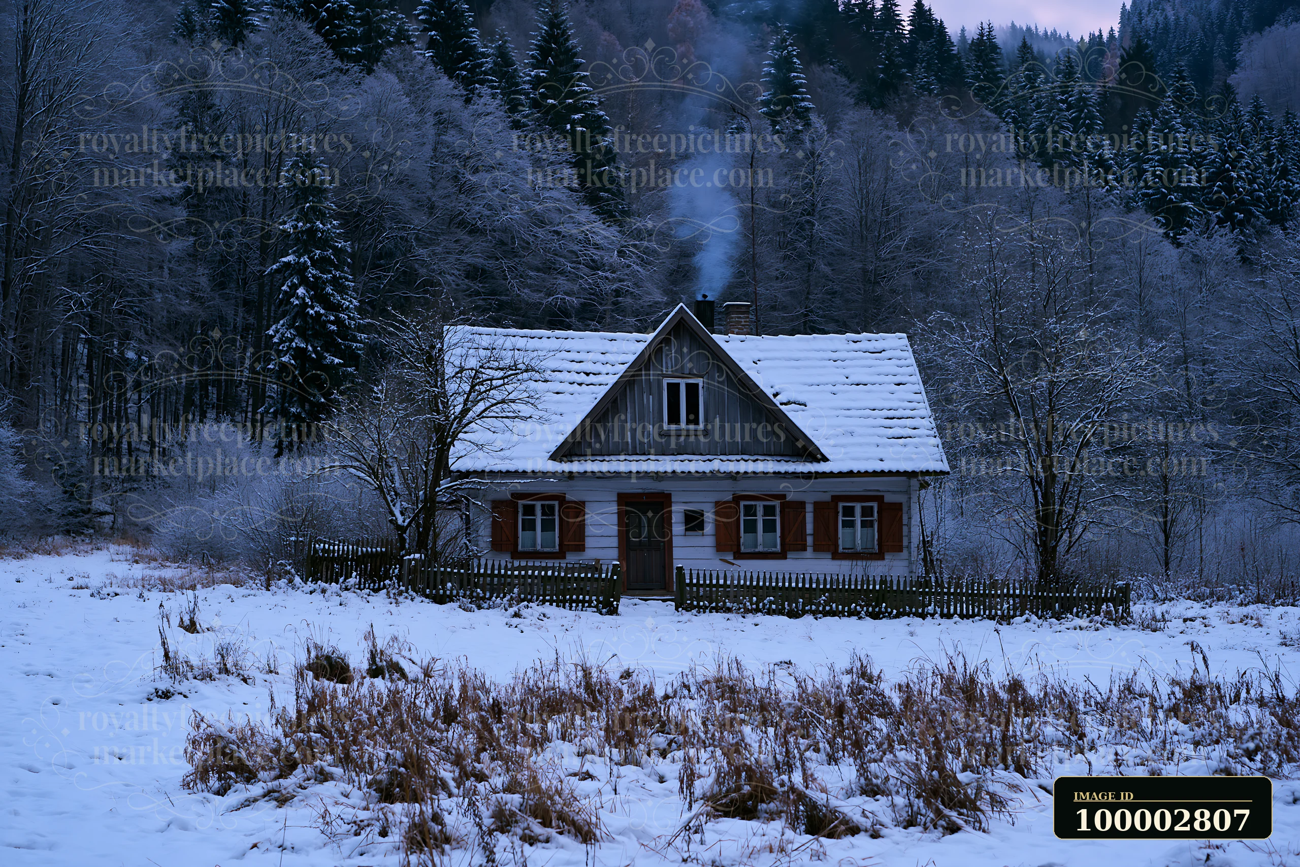 A rustic house with wooden shutters stands in a snowy field.