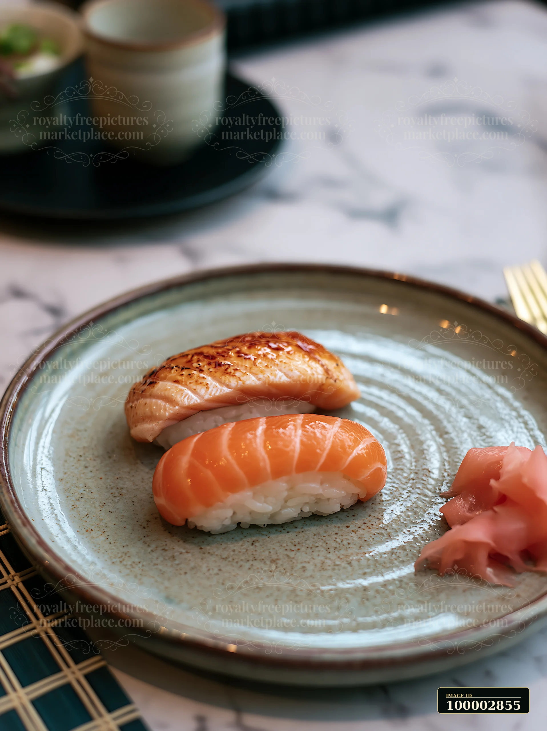 One sushi piece with pickled ginger sits on a ceramic plate.