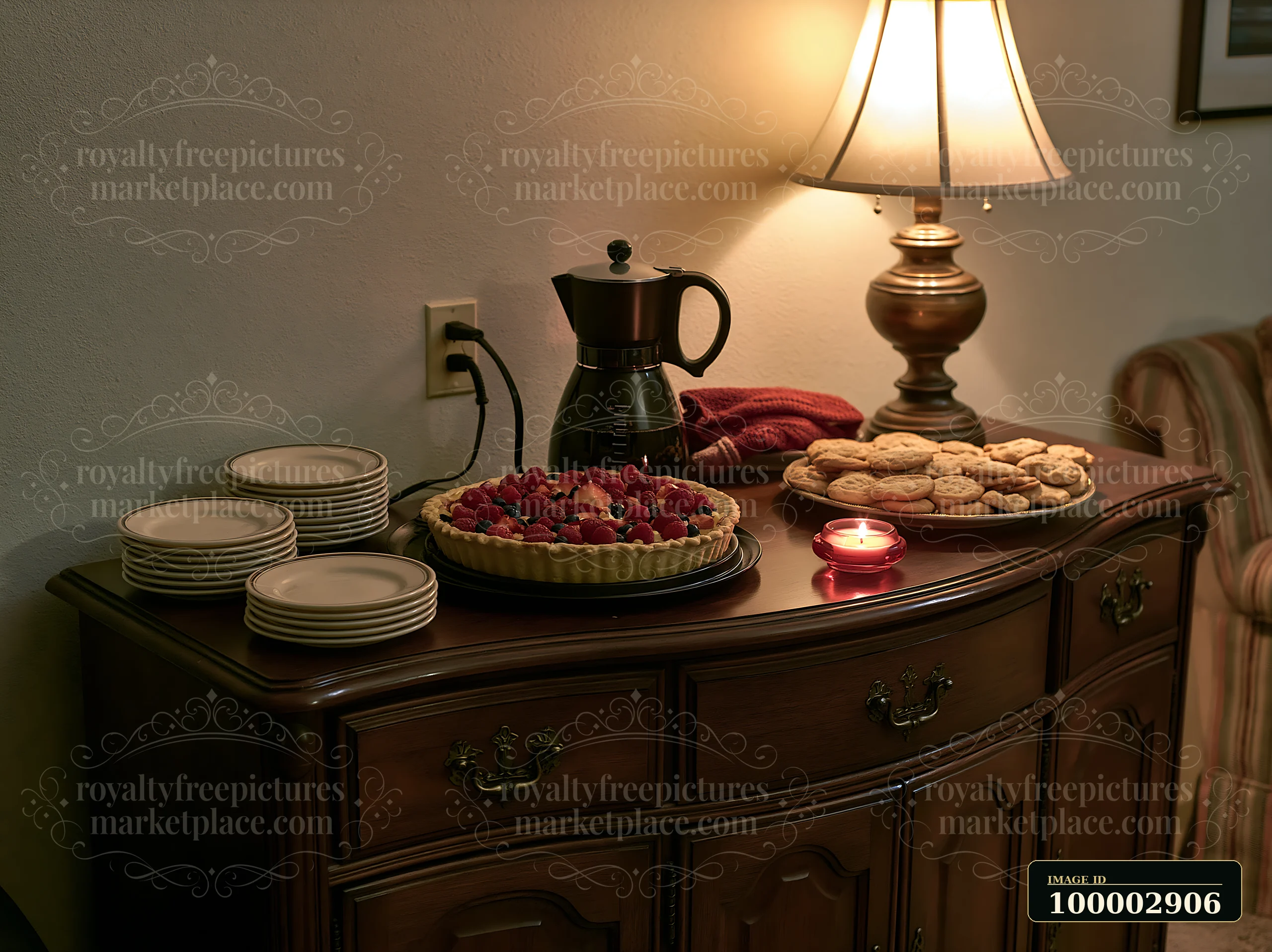 A dessert table features a pie with berries, cookies, and coffee, setting a cozy atmosphere for a holiday buffet dinner at home.