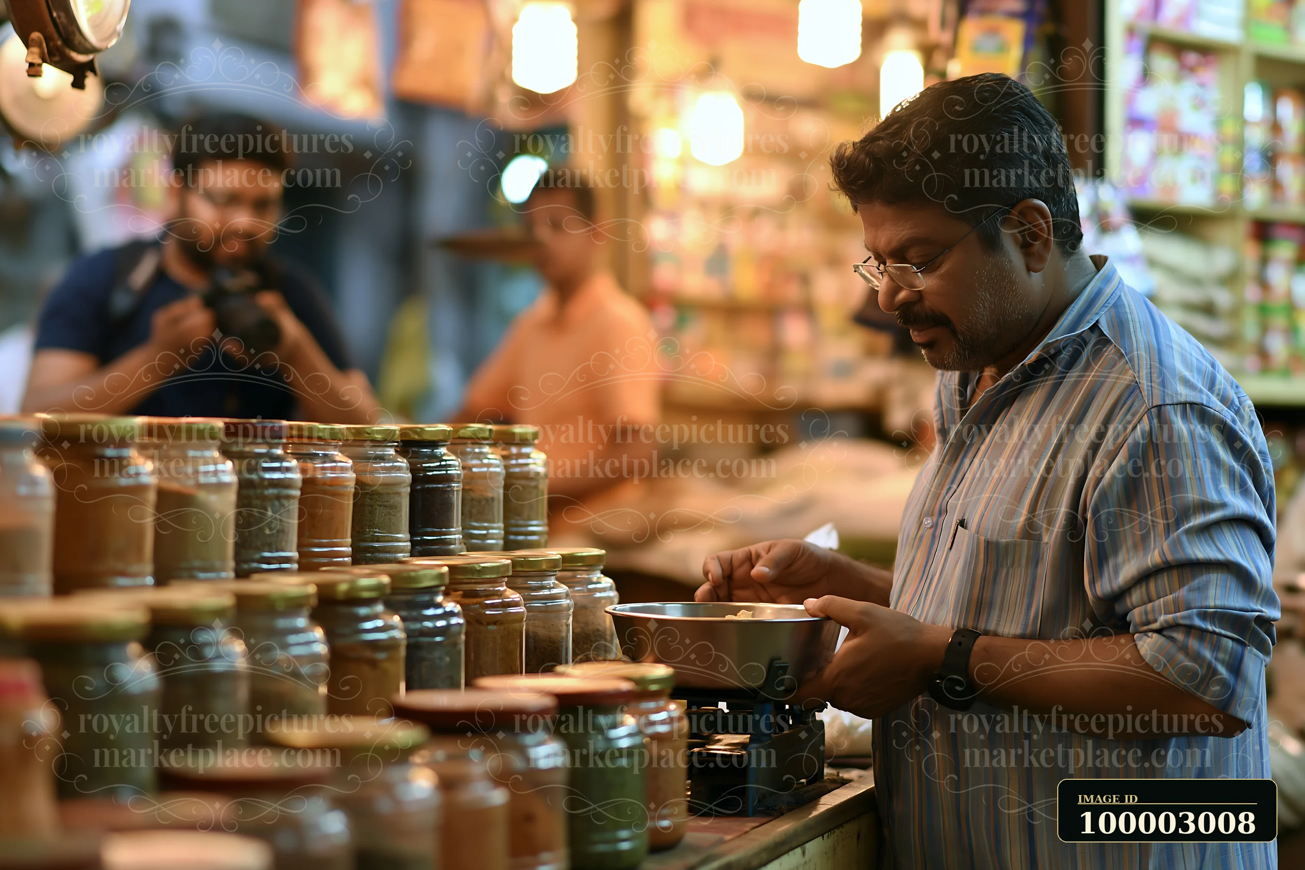 A man measures spices while a street photographer takes pictures in an urban market.
