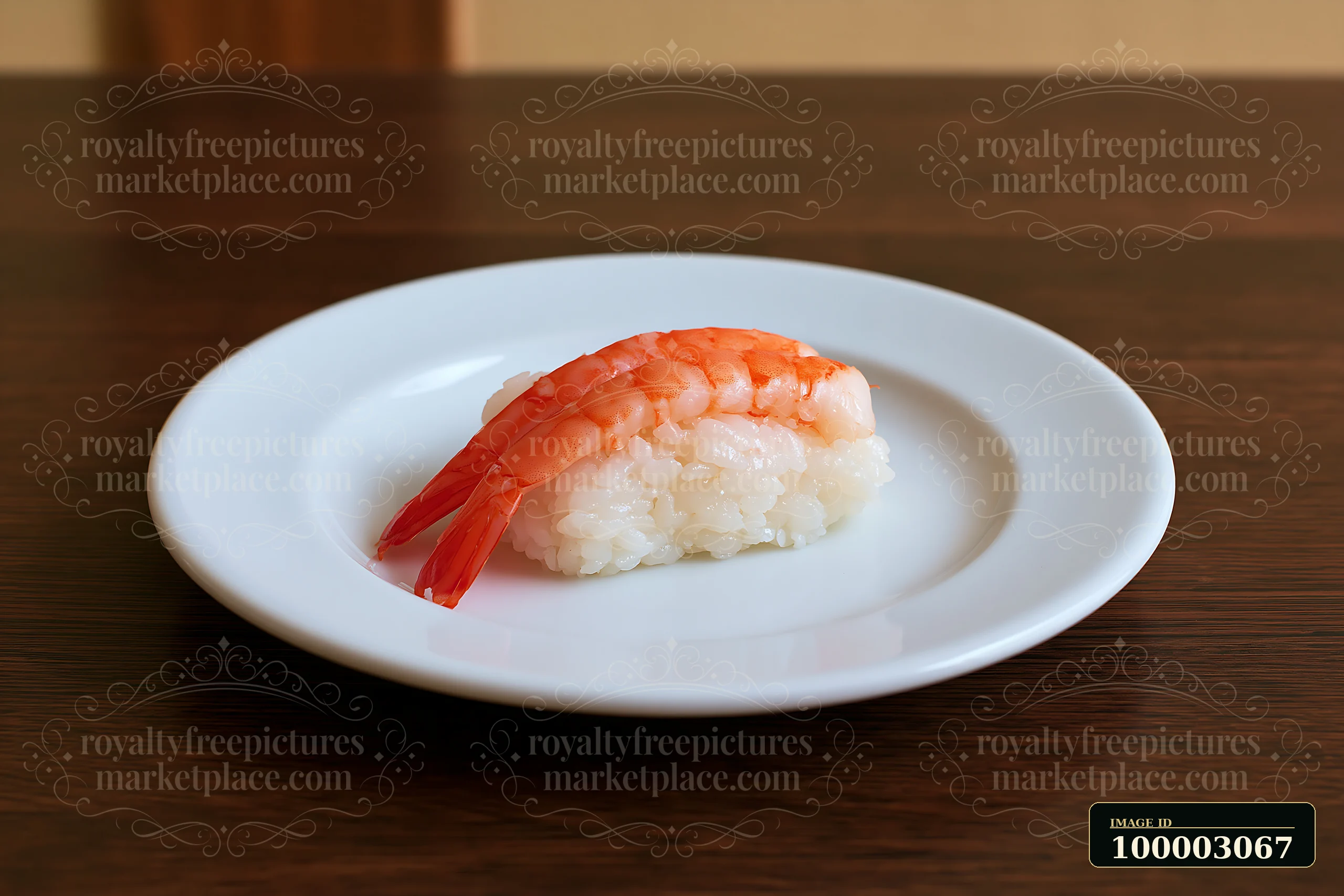 One shrimp sushi piece on white plate sits on a wooden table.