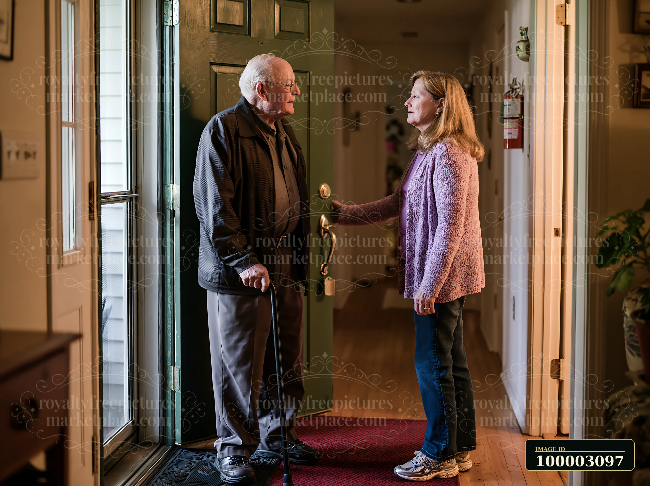 A man with Alzheimer's is warmly greeting a family member at the front door of his home.