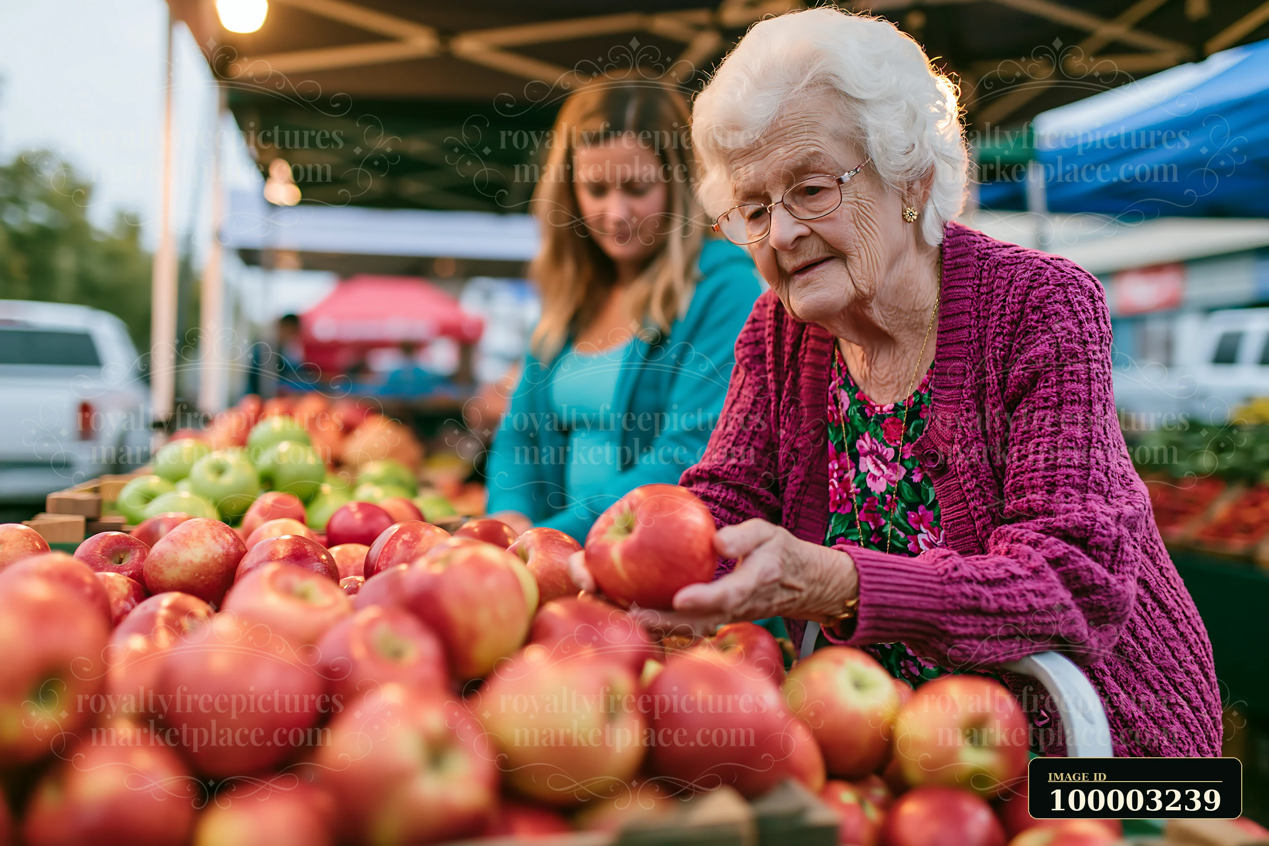 An elderly woman with dementia participating in daily activities is selecting apples at an outdoor market.