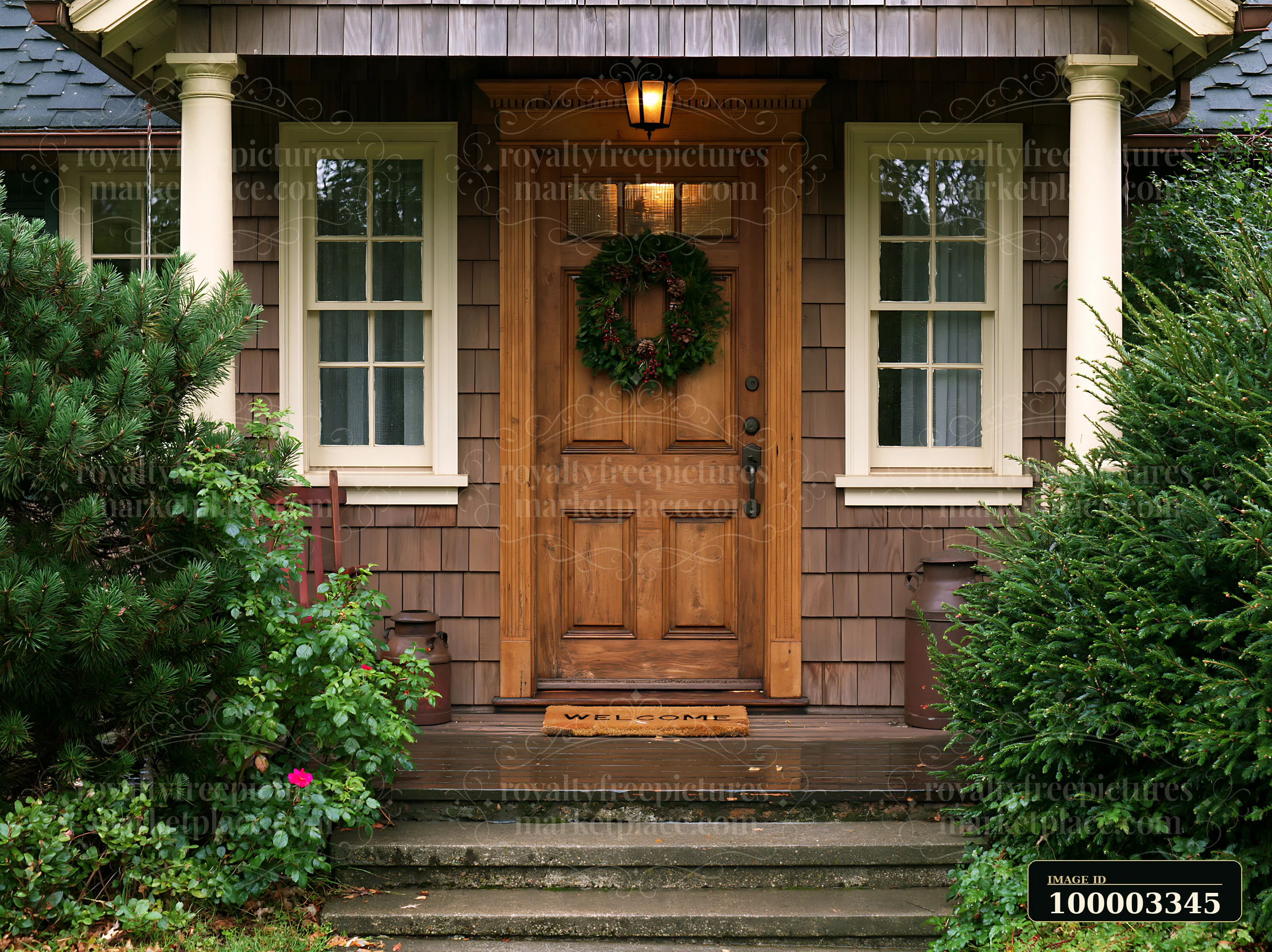 A rustic wooden front door with wreath and welcome mat stands at the entrance of a home, surrounded by lush green bushes and a simple pathway leading to the doo