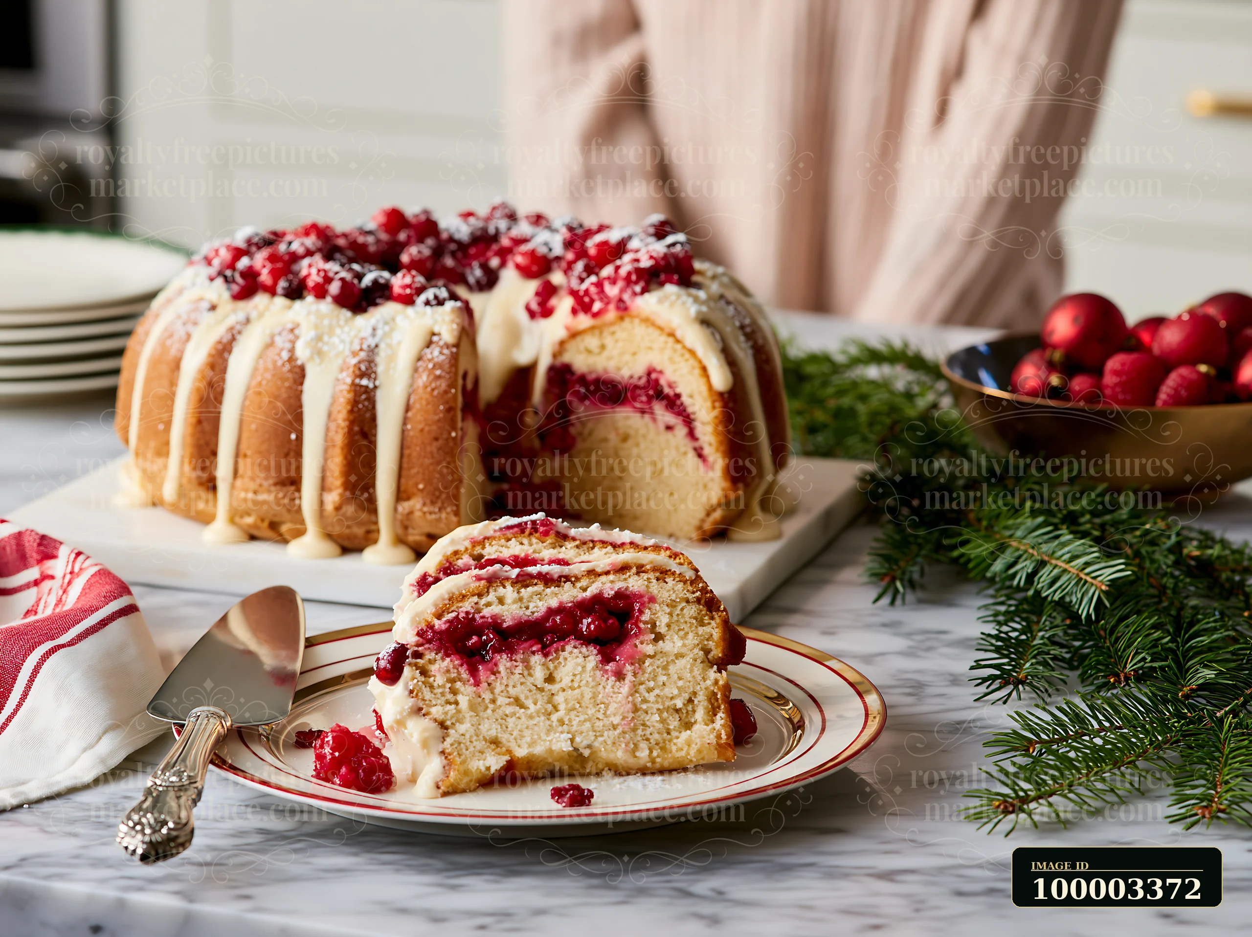 A bundt cake is showcased on a marble countertop in a kitchen.