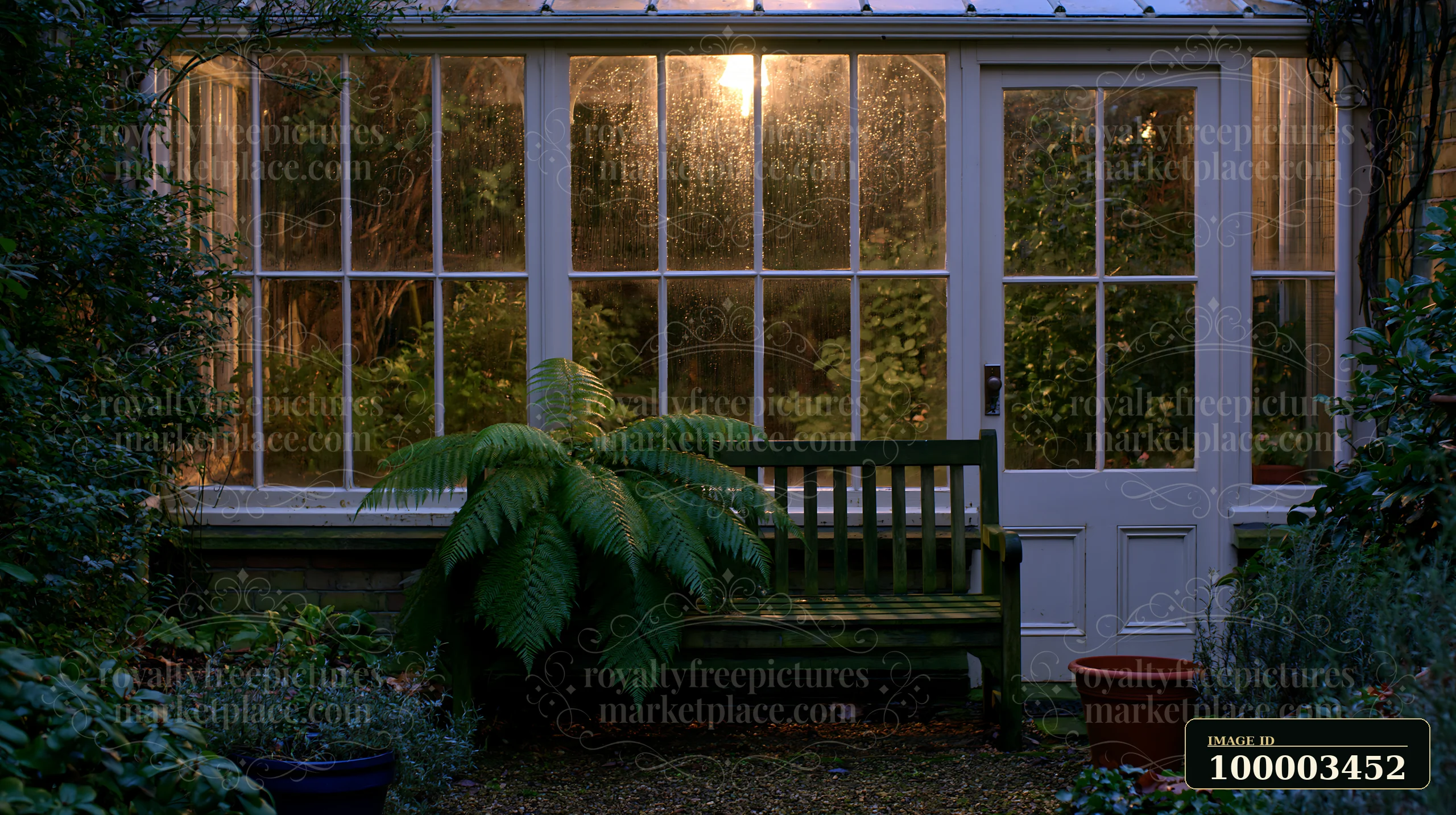 A conservatory stands empty, illuminated by warm light with soft evening glow.