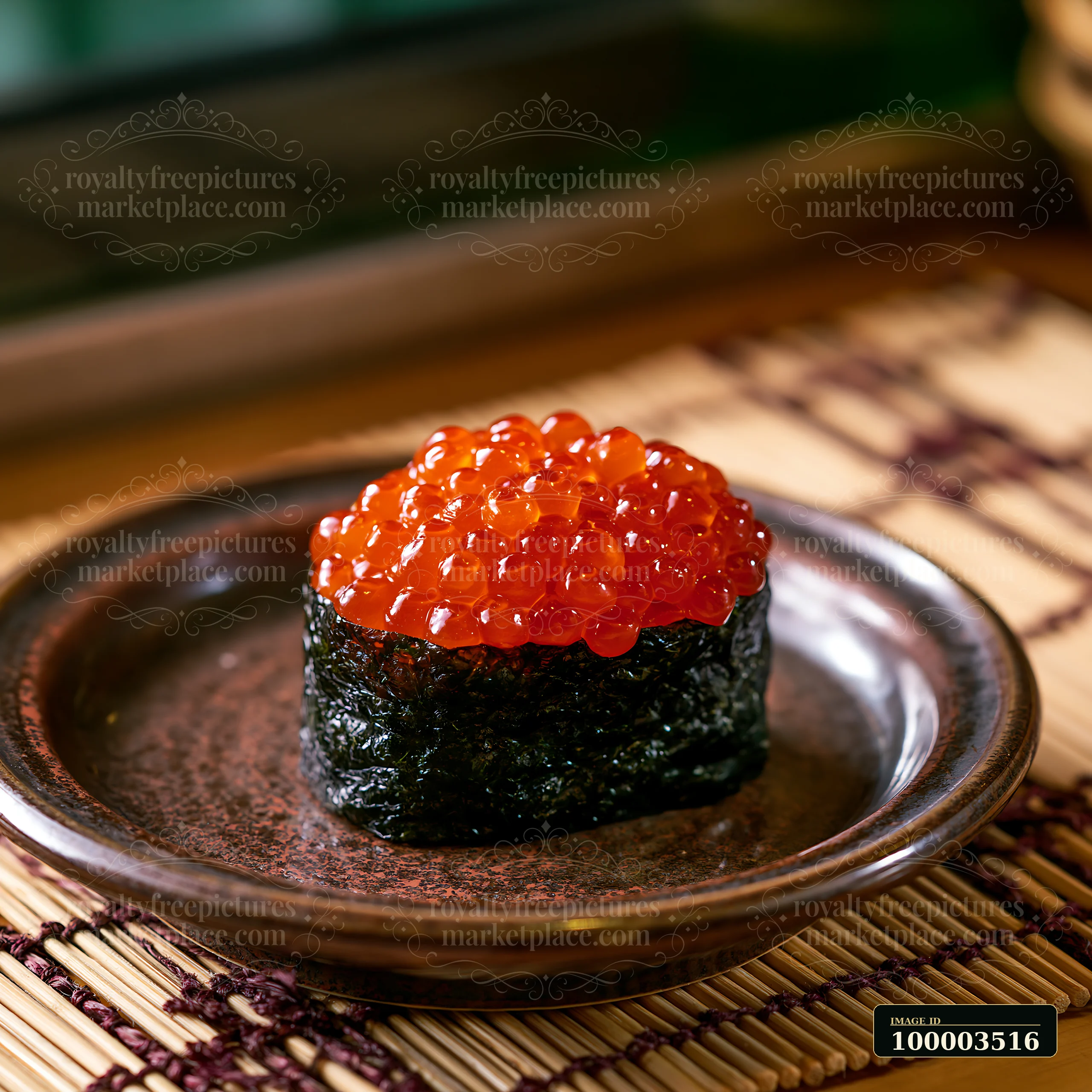 A close-up view of ikura salmon roe sushi on a dark plate, featuring bright orange roe piled on top of a rice base wrapped in seaweed.