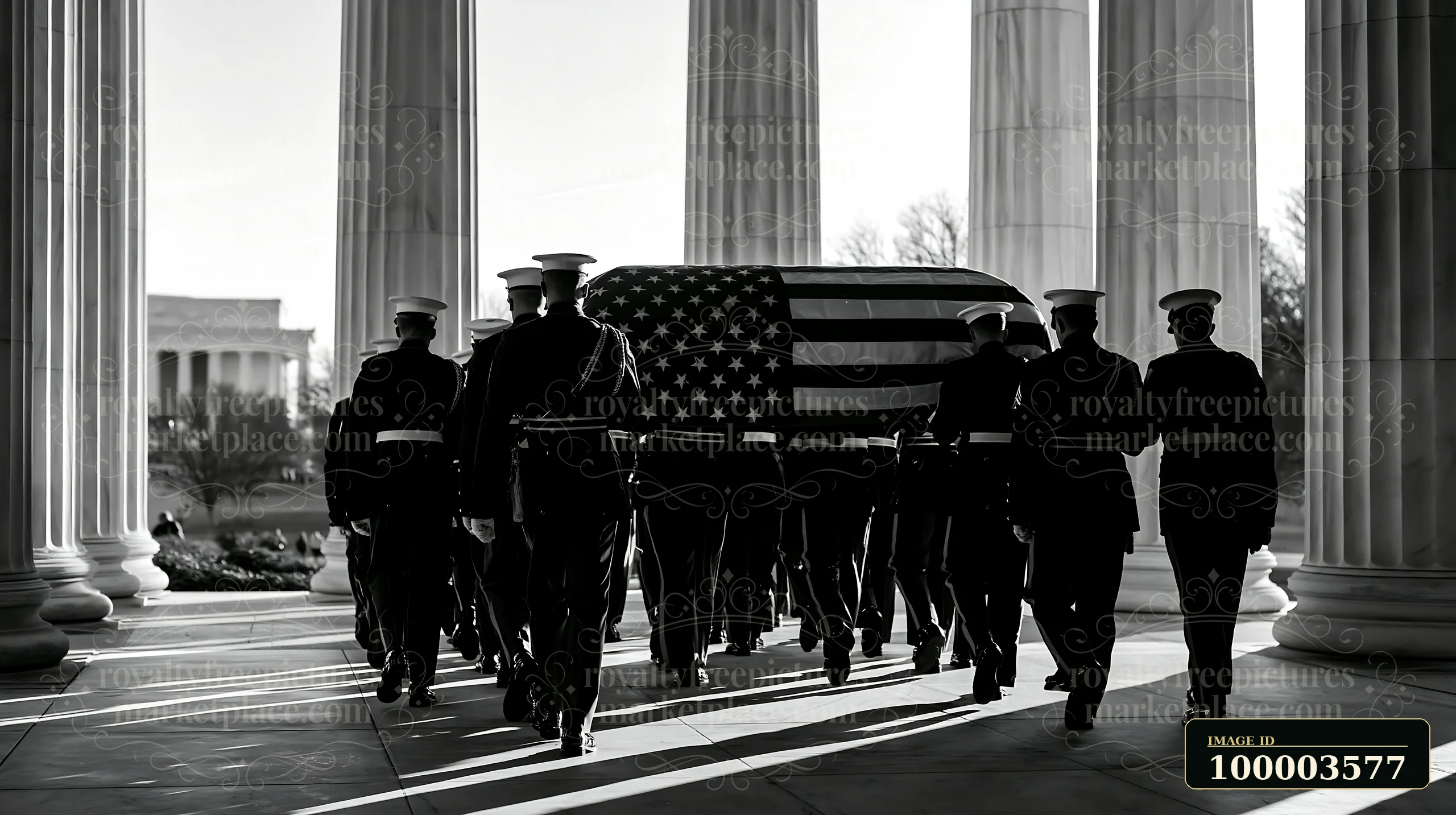 Servicemen carry a flag-draped coffin during a military funeral ceremony at a memorial site.