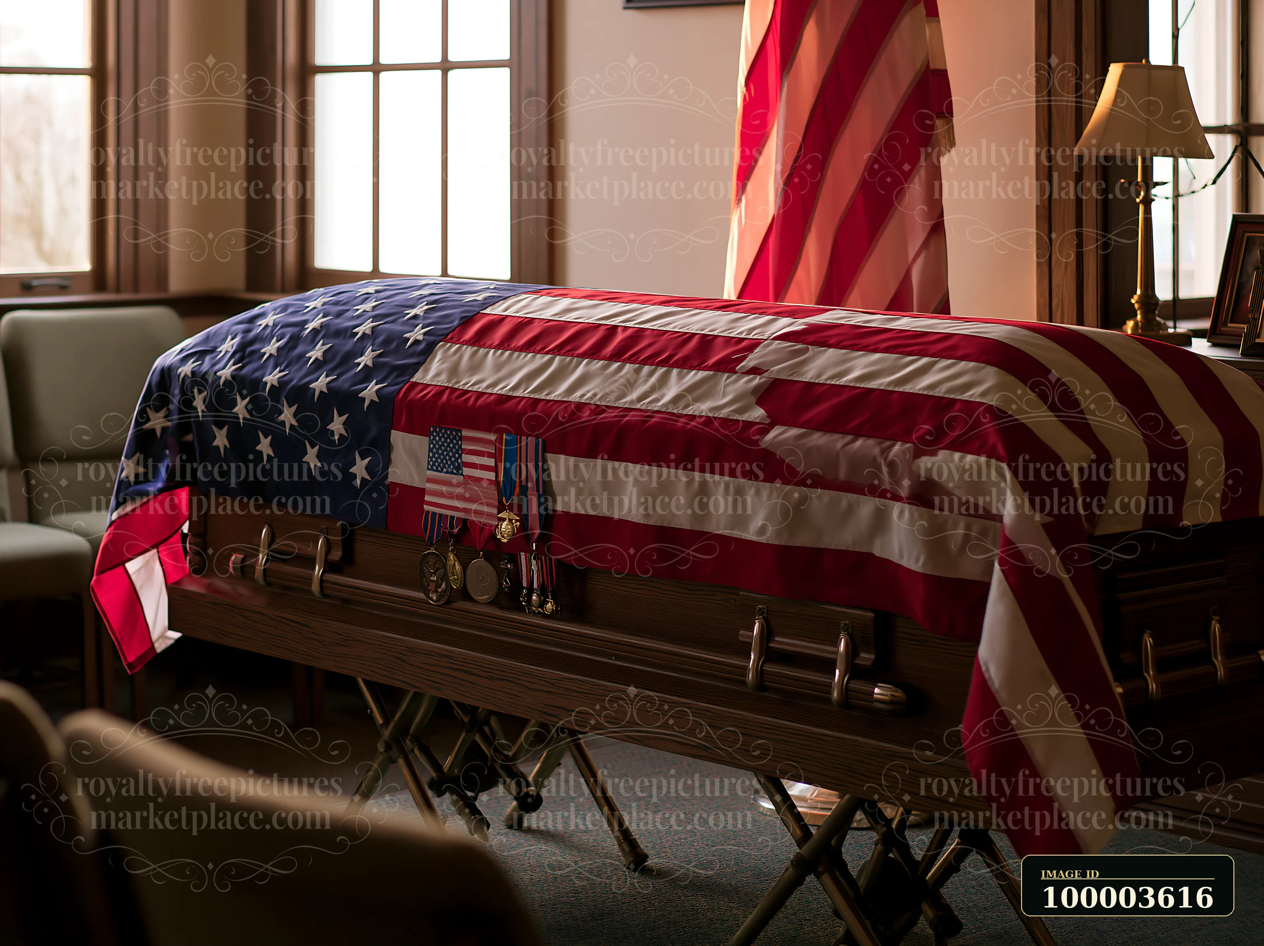 A veteran funeral casket with American flag and medals rests in a room with natural light.