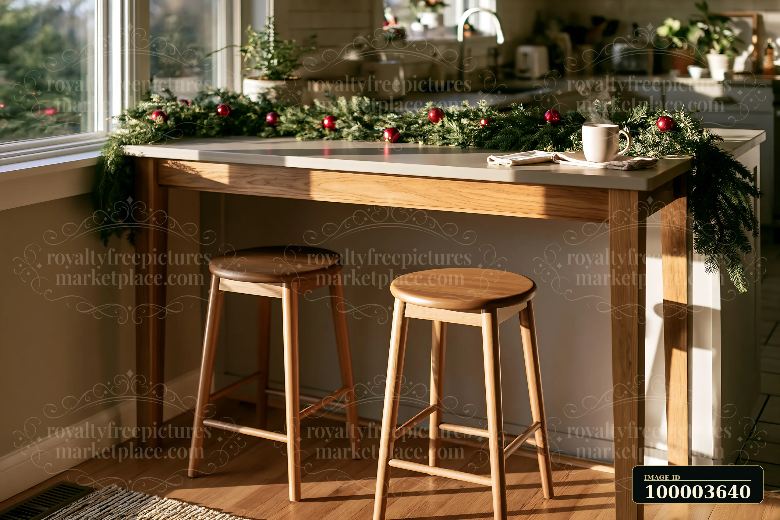 Breakfast bar with two wooden stools, evergreen garland, red ornaments, and a mug in a sunlit kitchen.