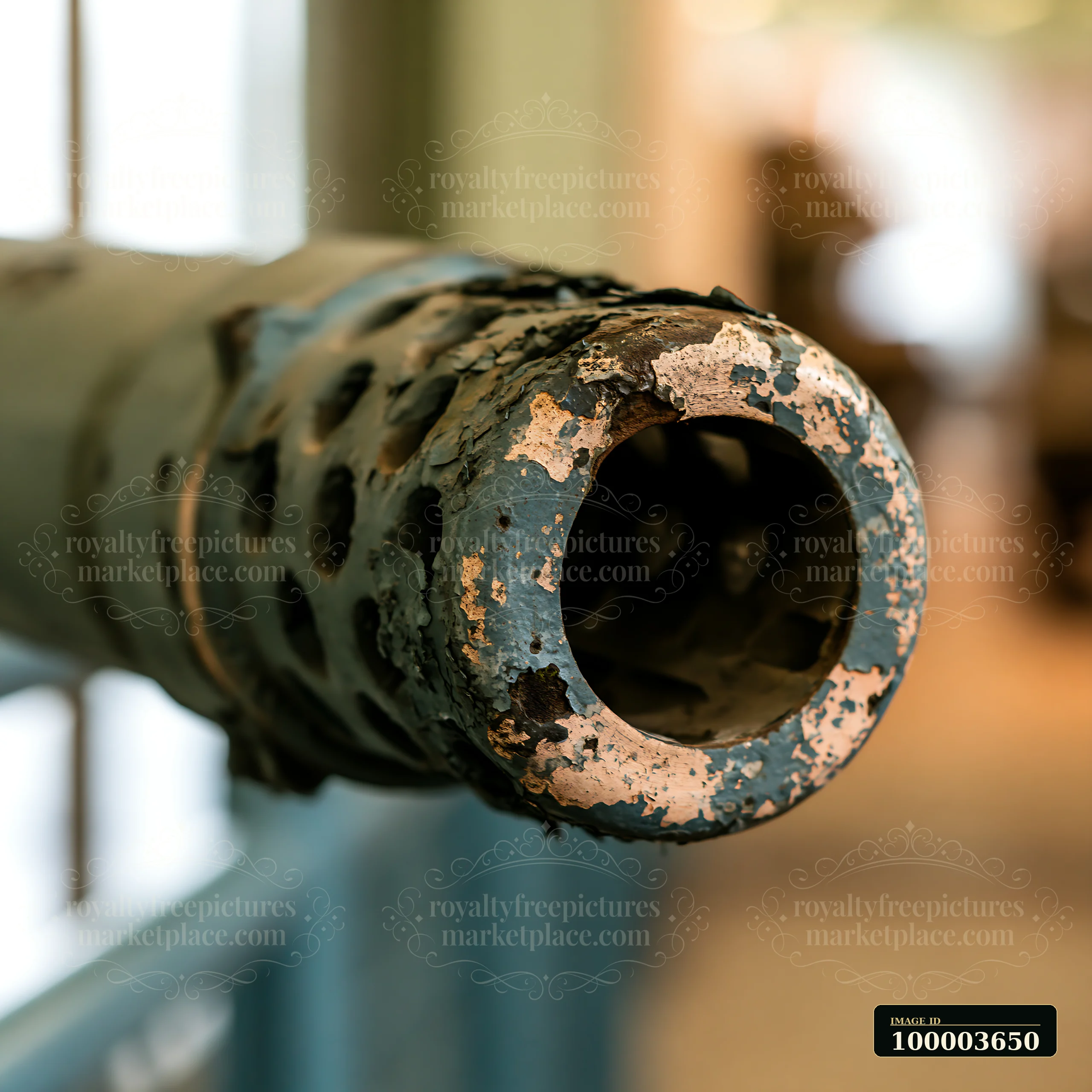 Close-up view of a panzer tank gun barrel detail showing the worn surface and blue color.