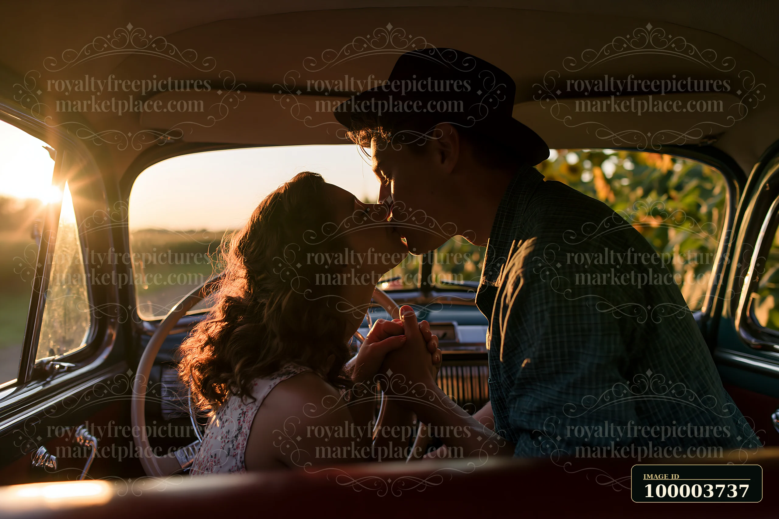 A couple kisses while seated in a vintage car, with sunlight streaming through the window.