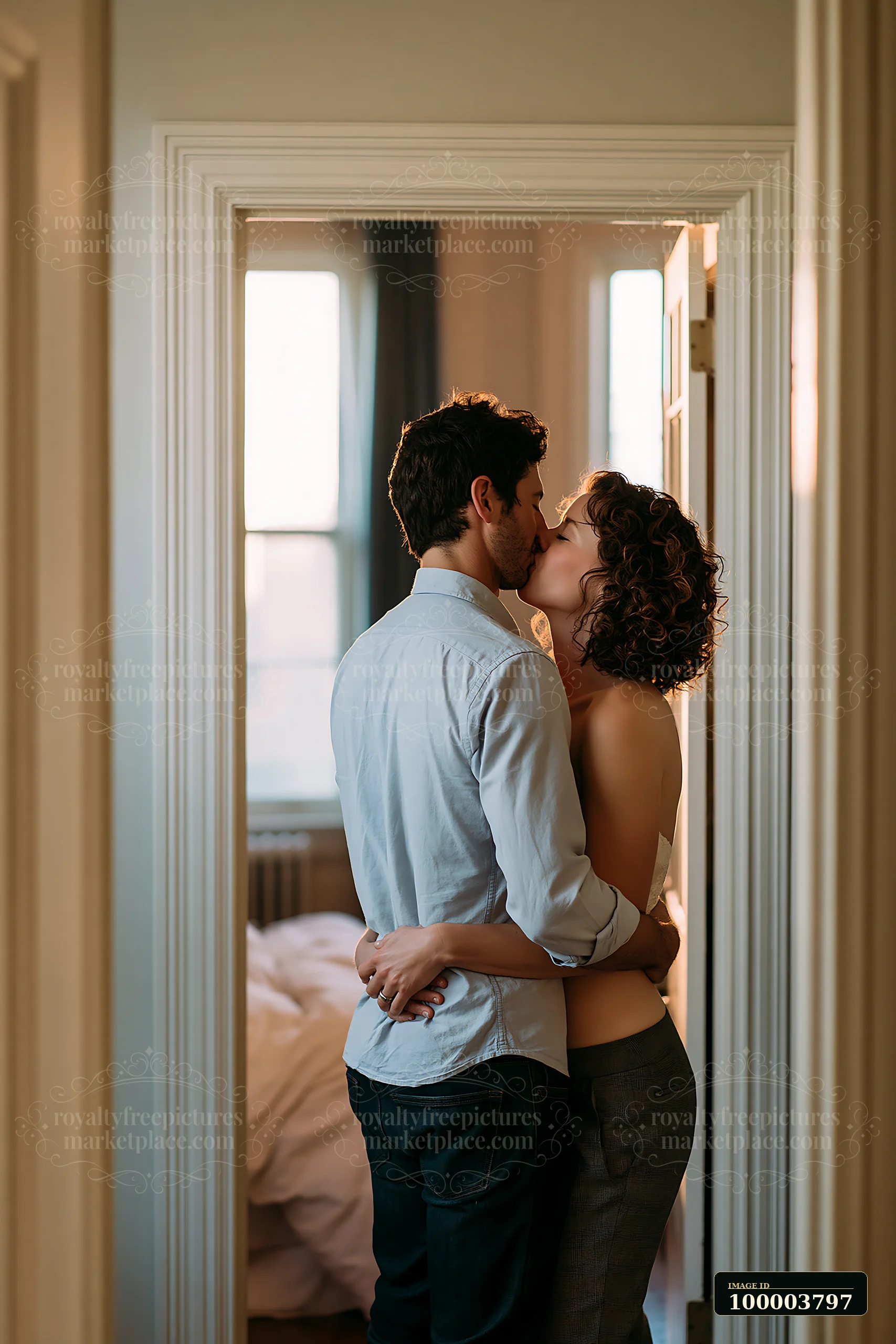 A couple is embraced in a doorway, sharing a kiss as they prepare to leave for work.