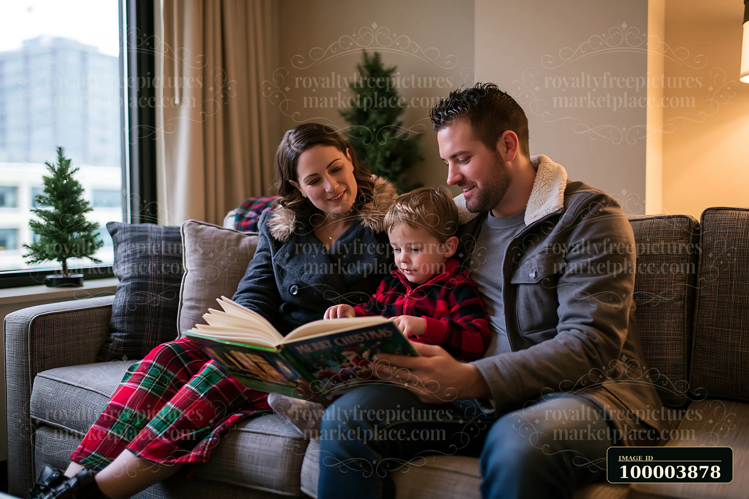 Parents and their young son read a Christmas story together on a sofa in a warmly lit living room.