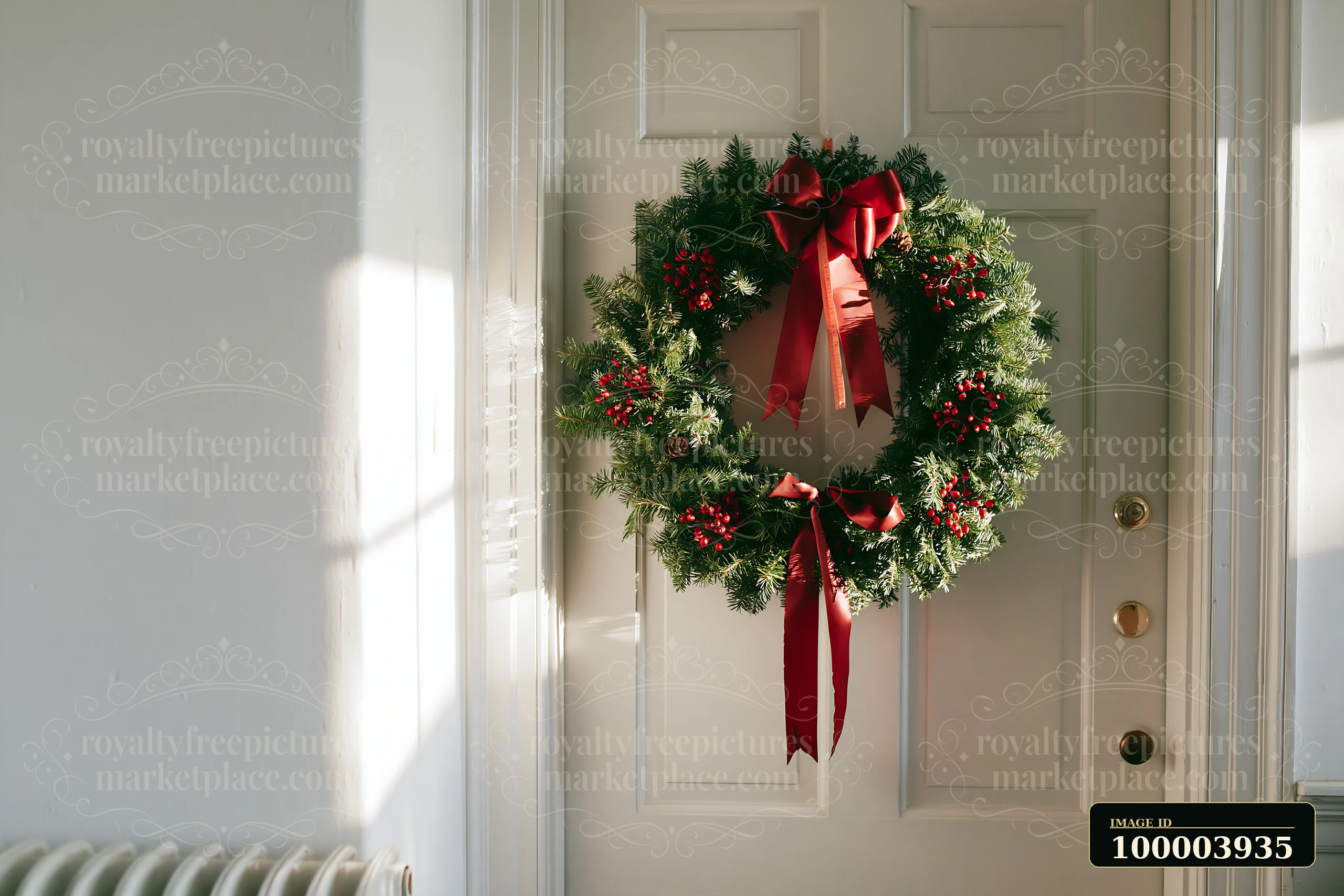 Evergreen Christmas wreath with red ribbons and berries hanging on a paneled apartment door.