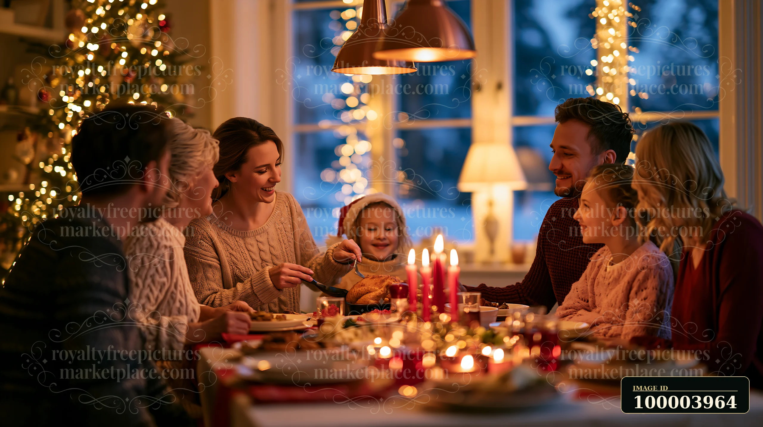 Six family members share a Christmas dinner around a candlelit table beside a decorated tree.