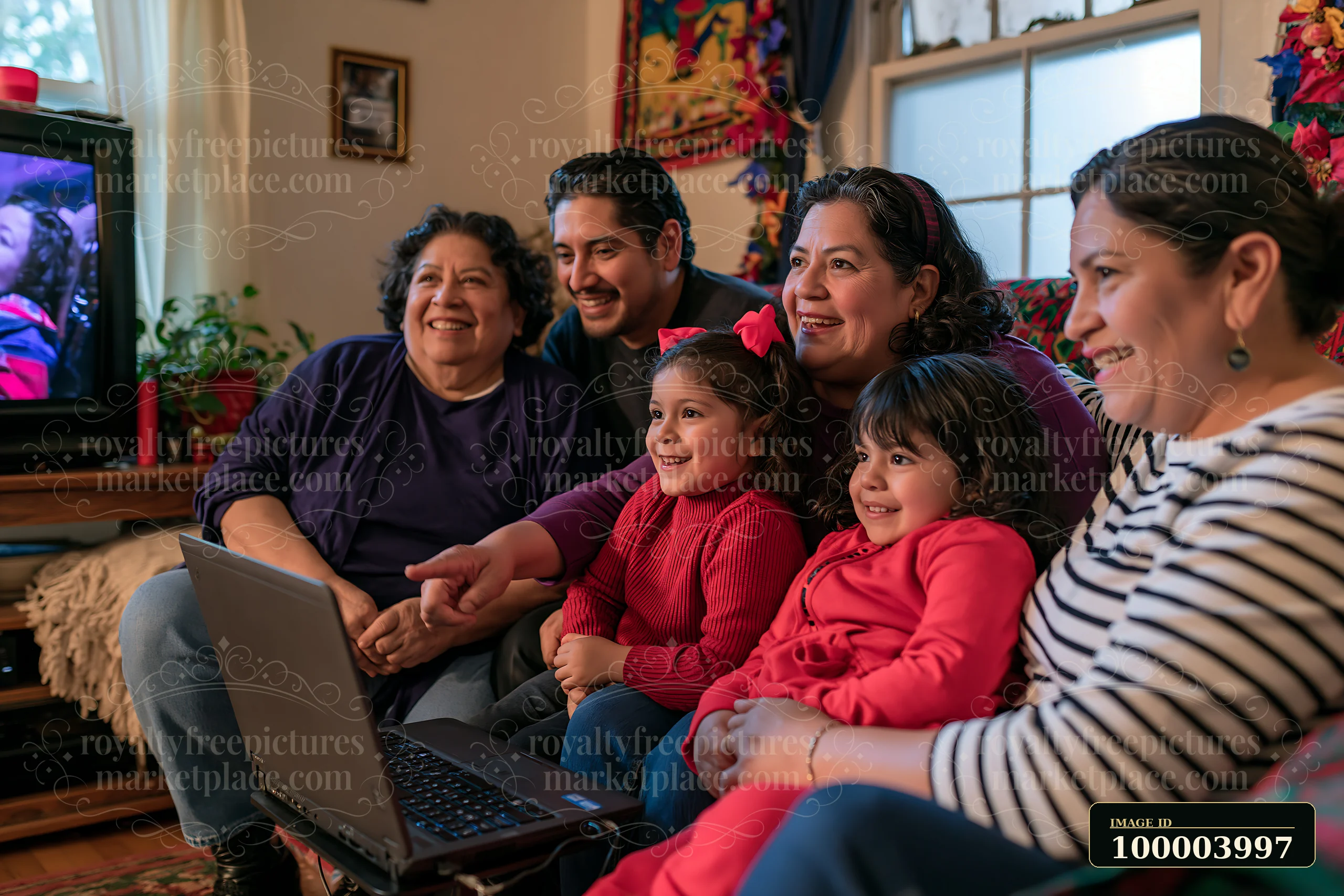 A family gathers on a couch, enjoying a holiday movie while sharing smiles and laughter.