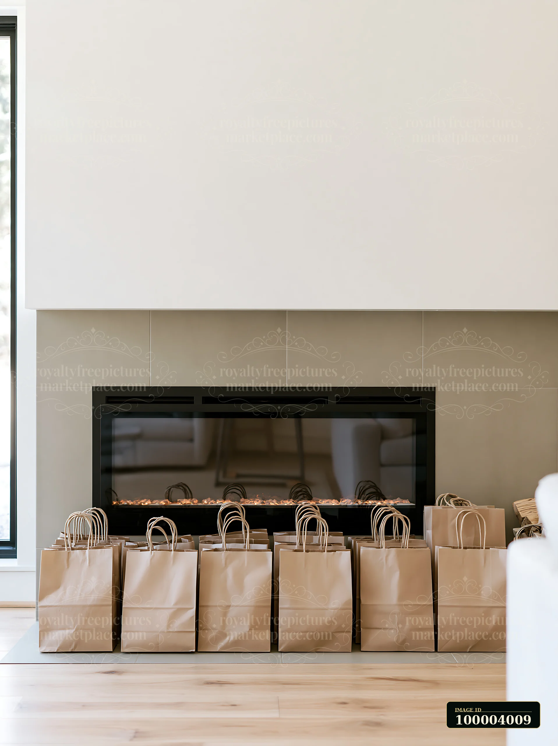 Paper shopping bags arranged beside a modern fireplace in a bright living room.