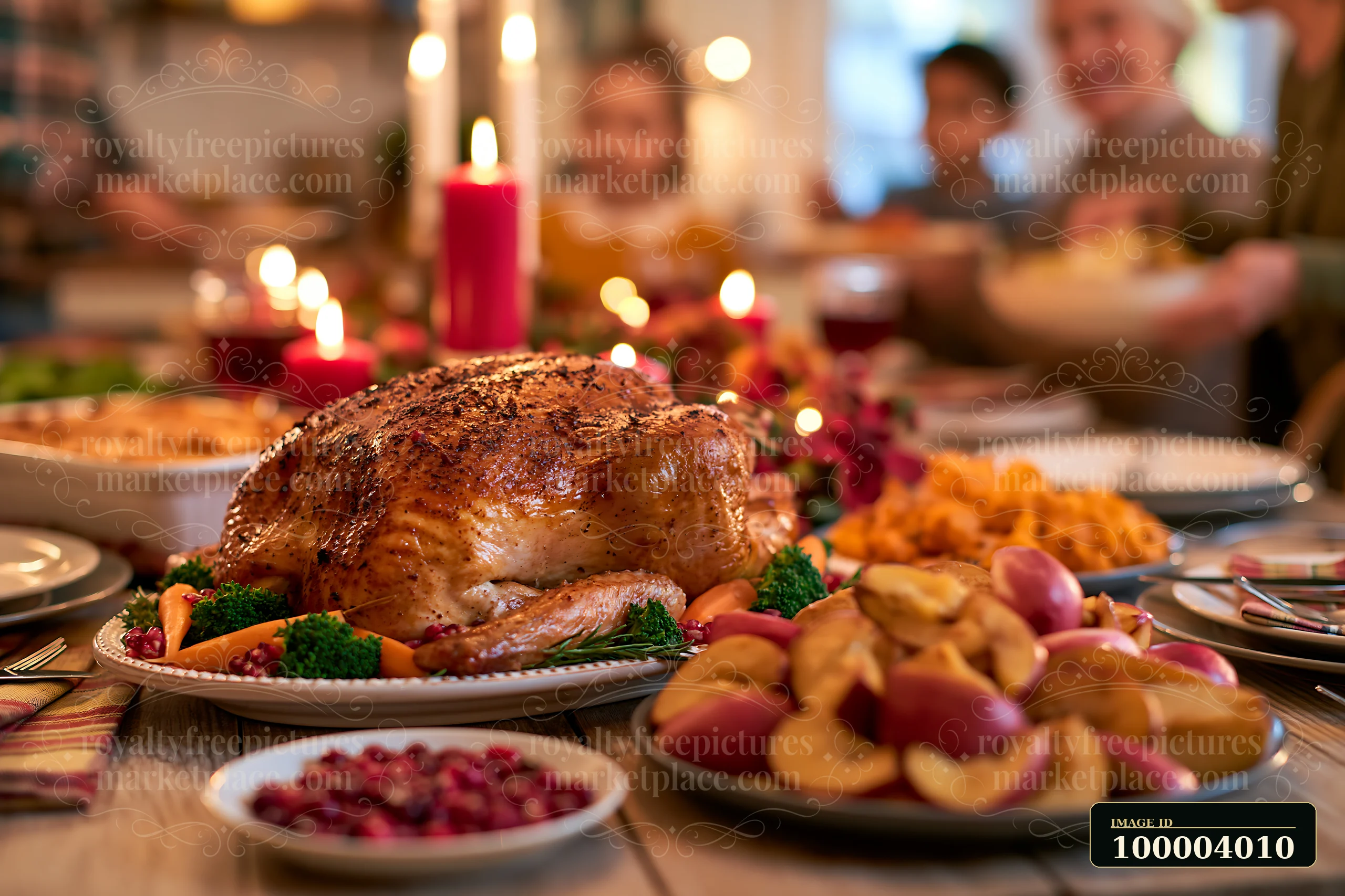Roasted turkey surrounded by festive side dishes and candles on a dining table, with blurred diners behind it.