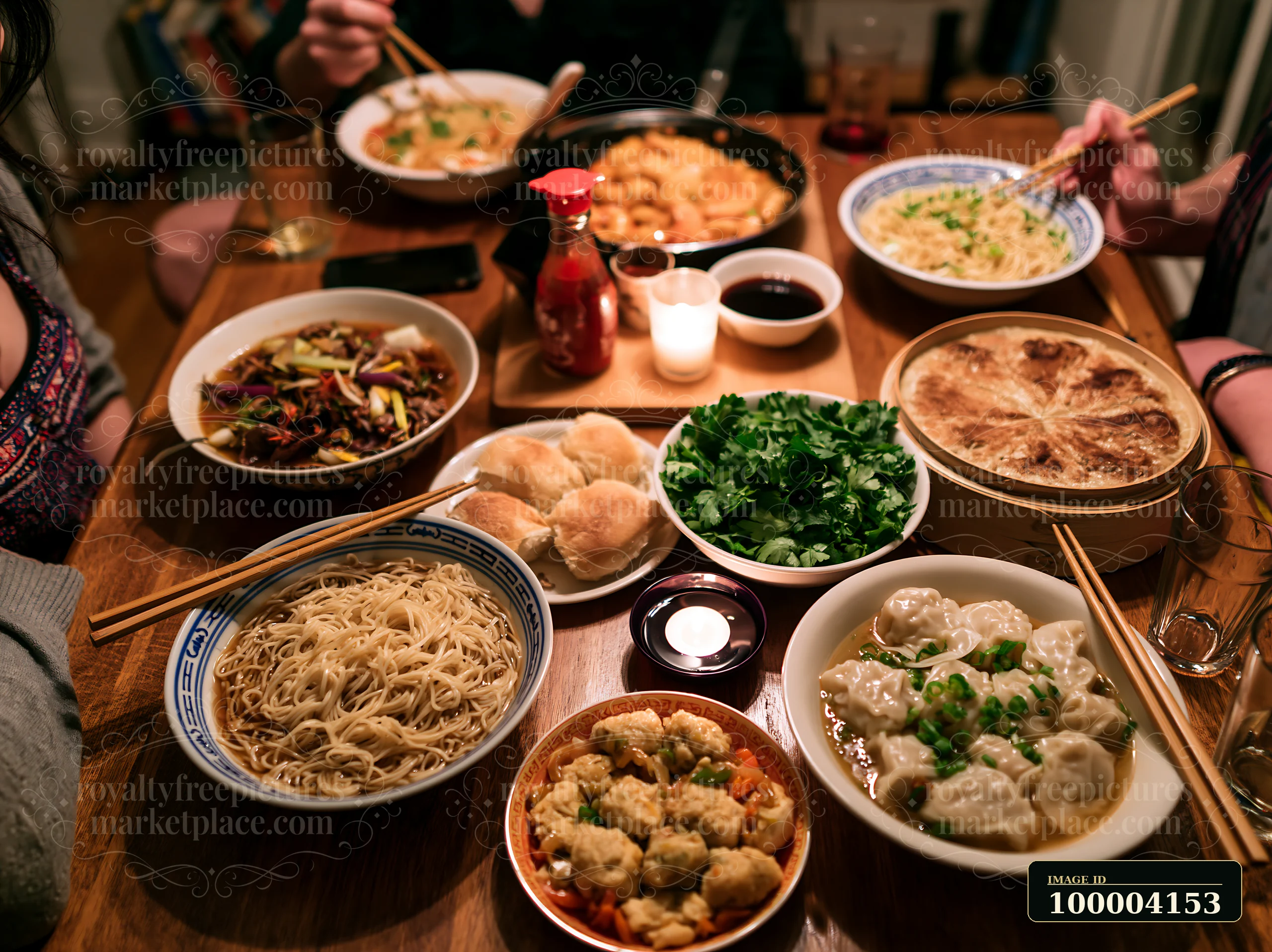 Shared holiday meal with noodles, dumplings, vegetables, bread, and diners gathered around a warmly lit table.