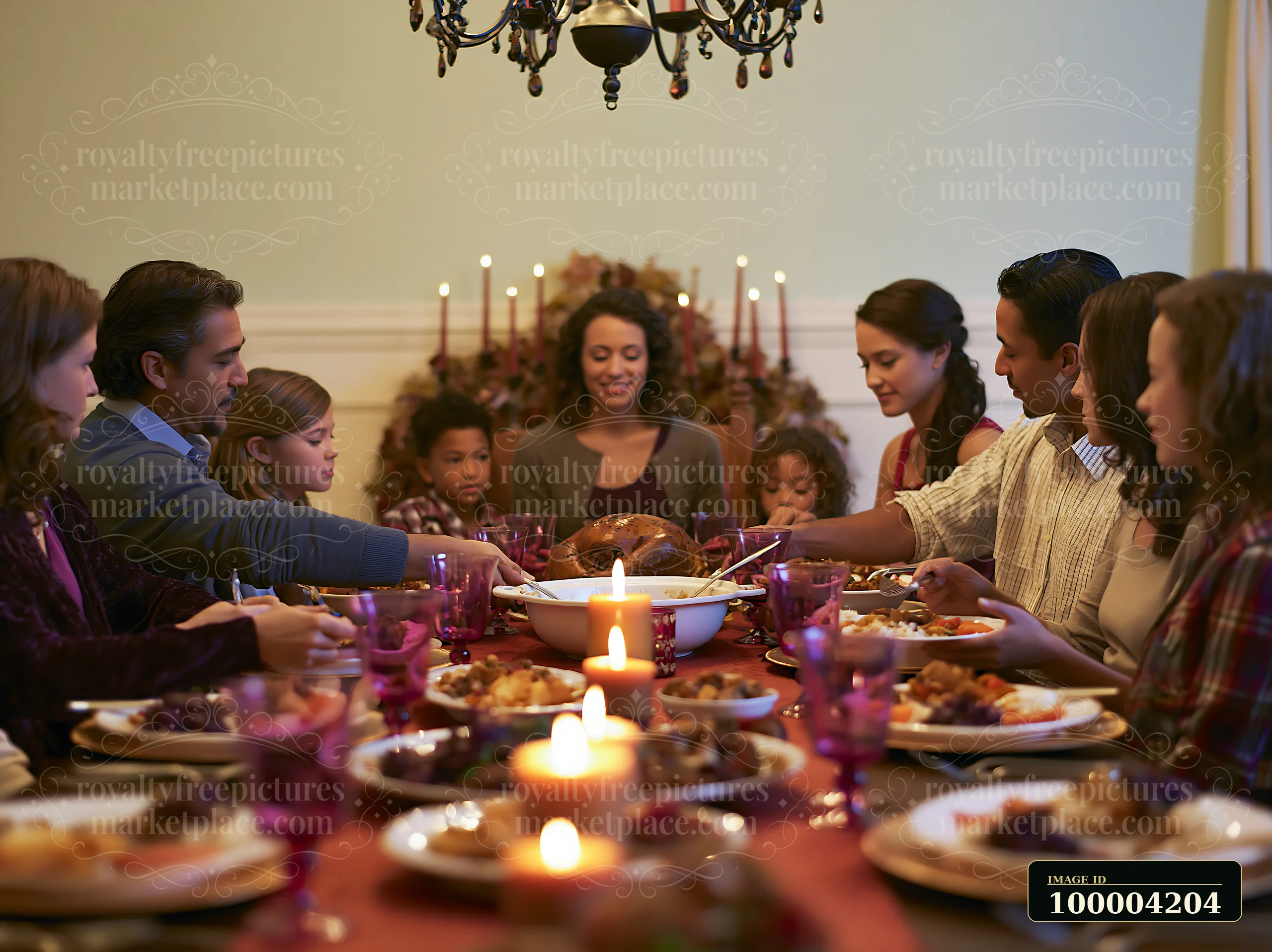 A group of family members sits around a table enjoying a holiday meal served family-style.