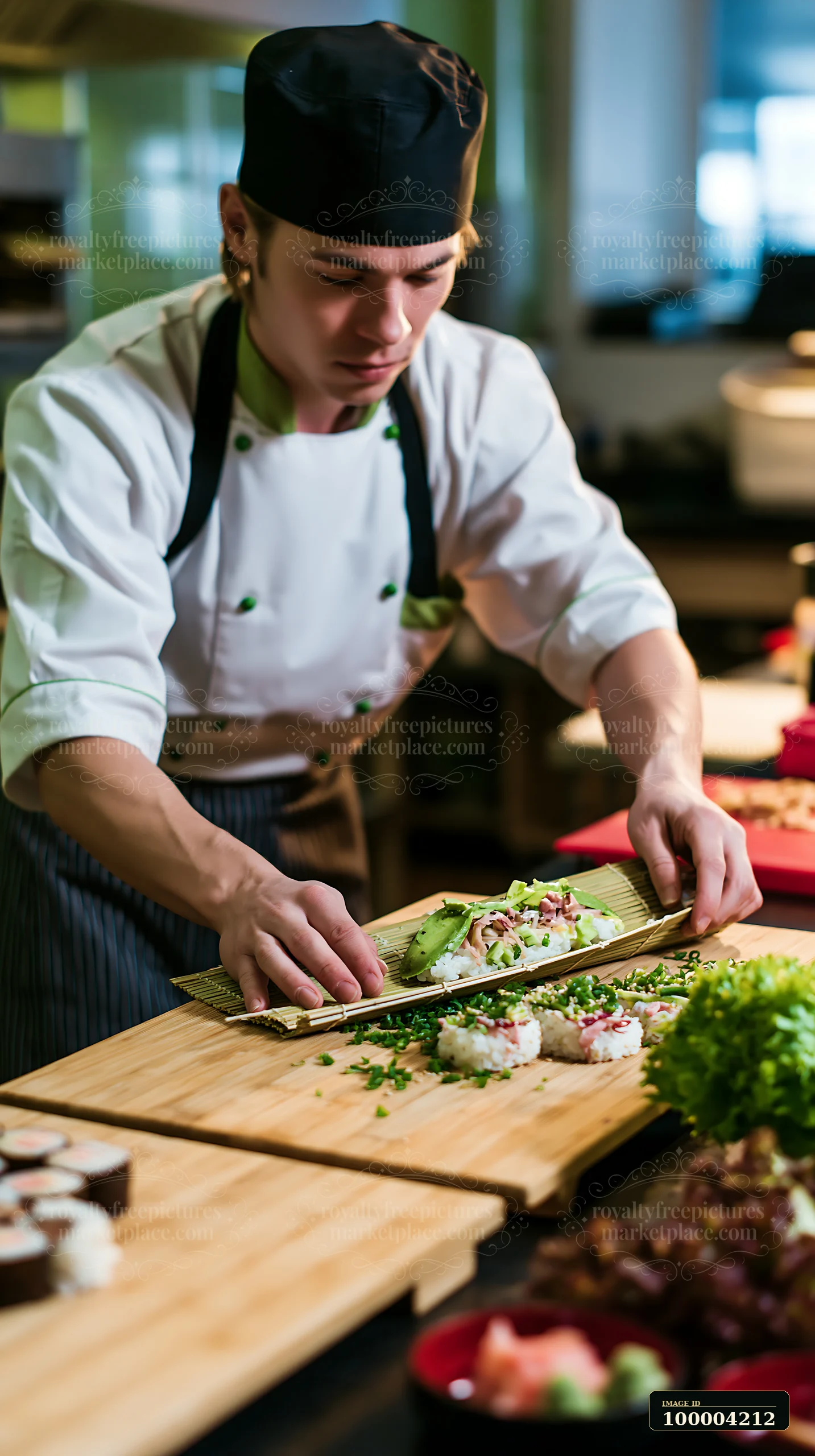 A sushi chef is preparing sushi beside wooden serving boards in a kitchen.