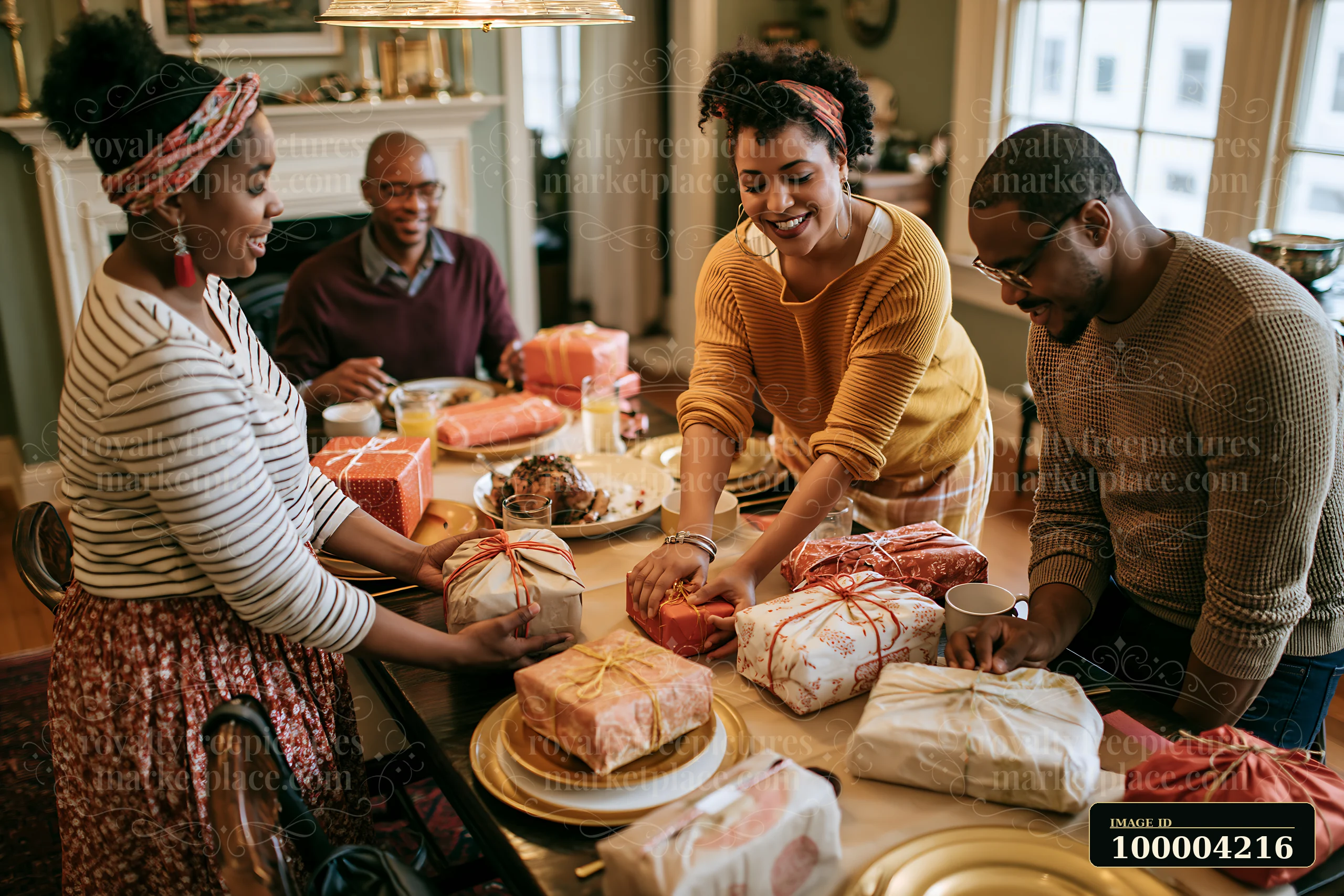 Family members work together to place wrapped gifts on a dining table filled with food and decorations.