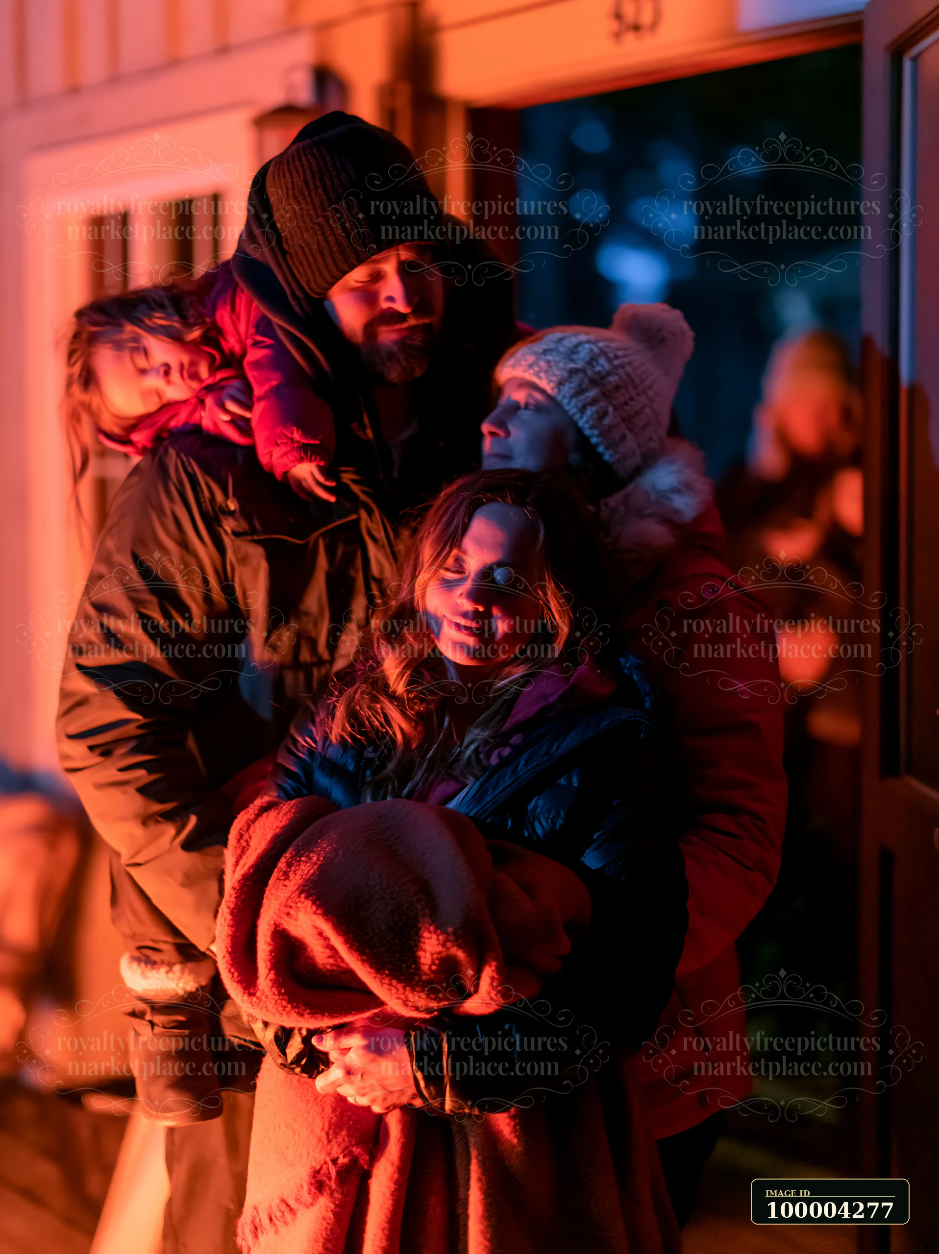 Parents carry a sleeping child through a warmly lit doorway while bundled family members gather indoors.