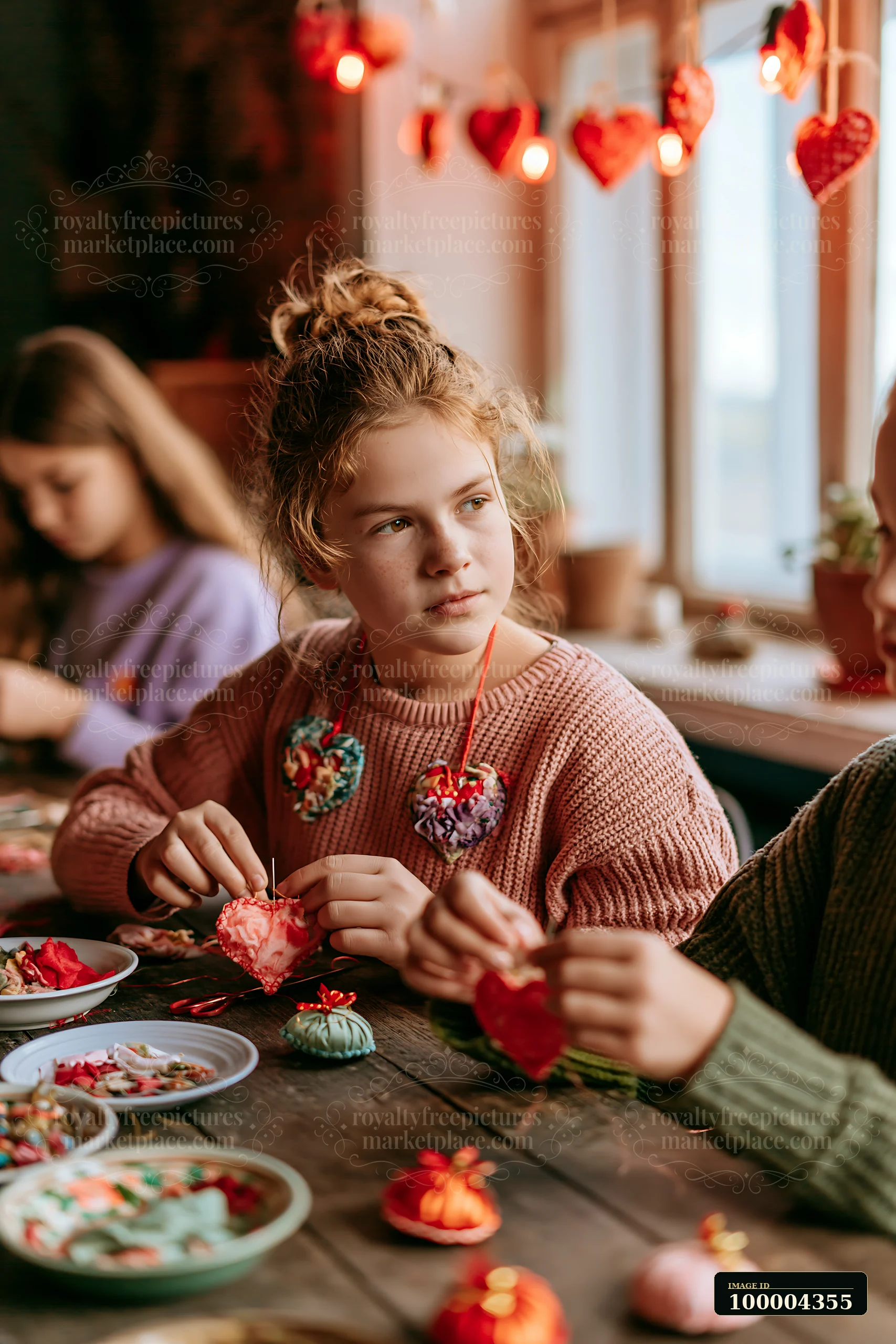 A group of children create handmade ornaments at a wooden table in a cozy room filled with warm lighting.