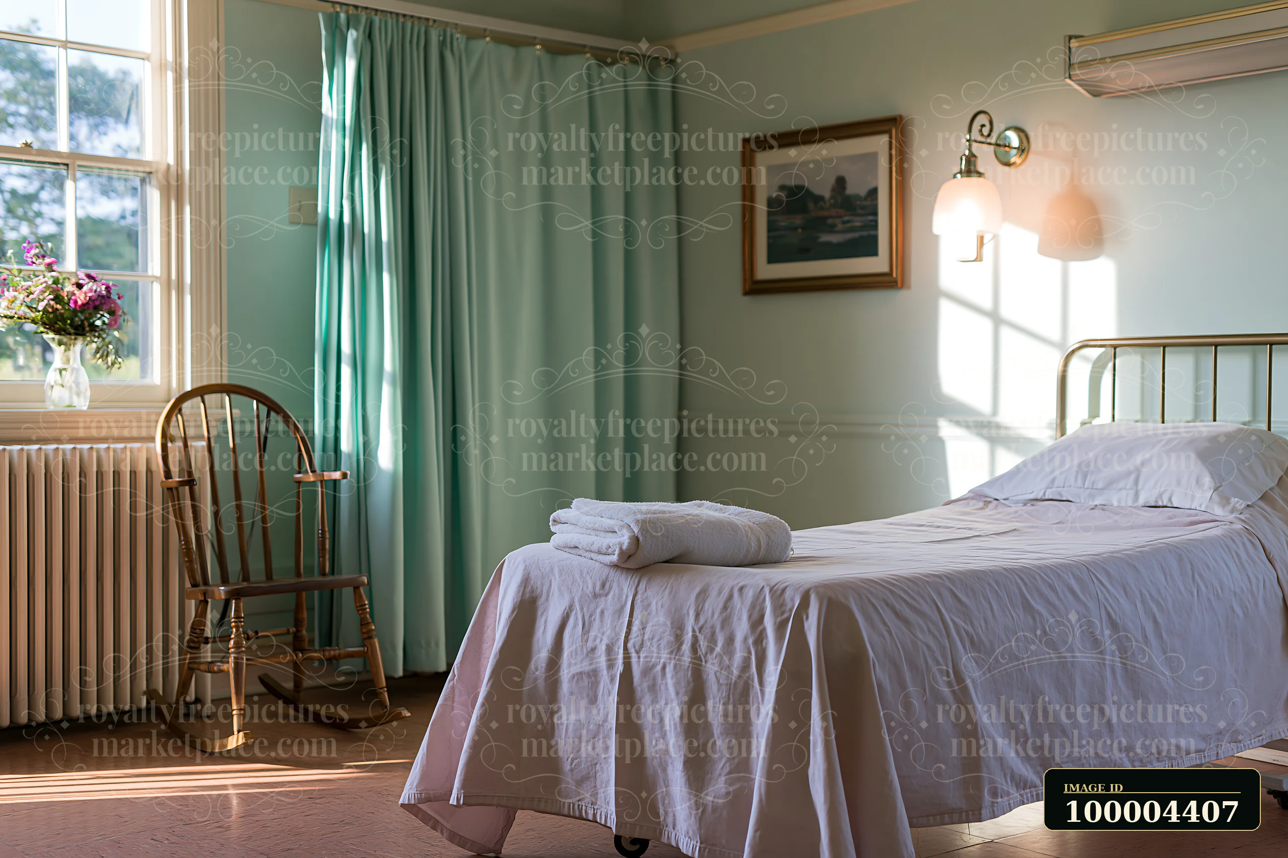 An empty bed in a hospice room features a neatly made white bed with a towel.