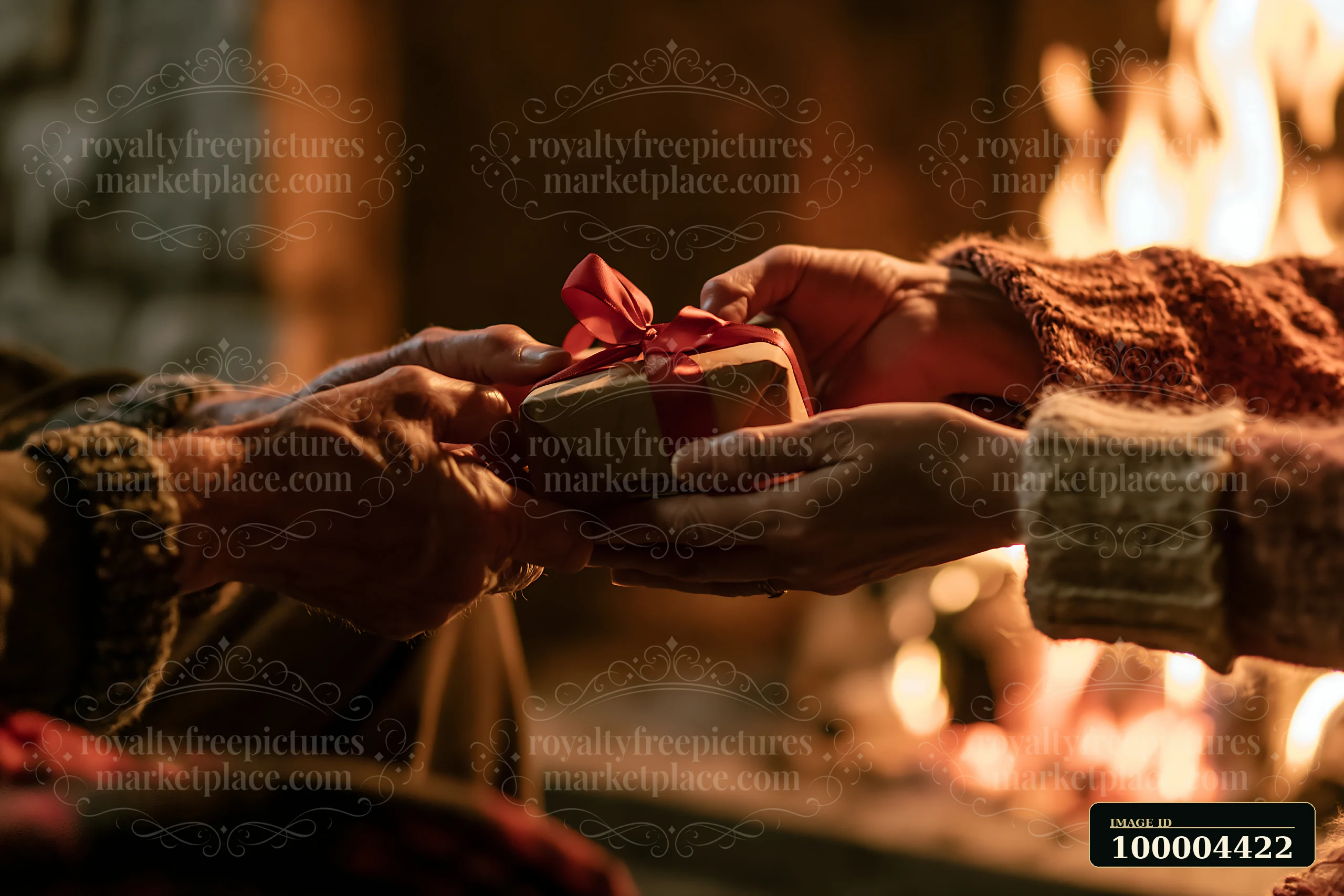 Hands pass a red-ribboned gift in warm light beside a glowing fireplace.