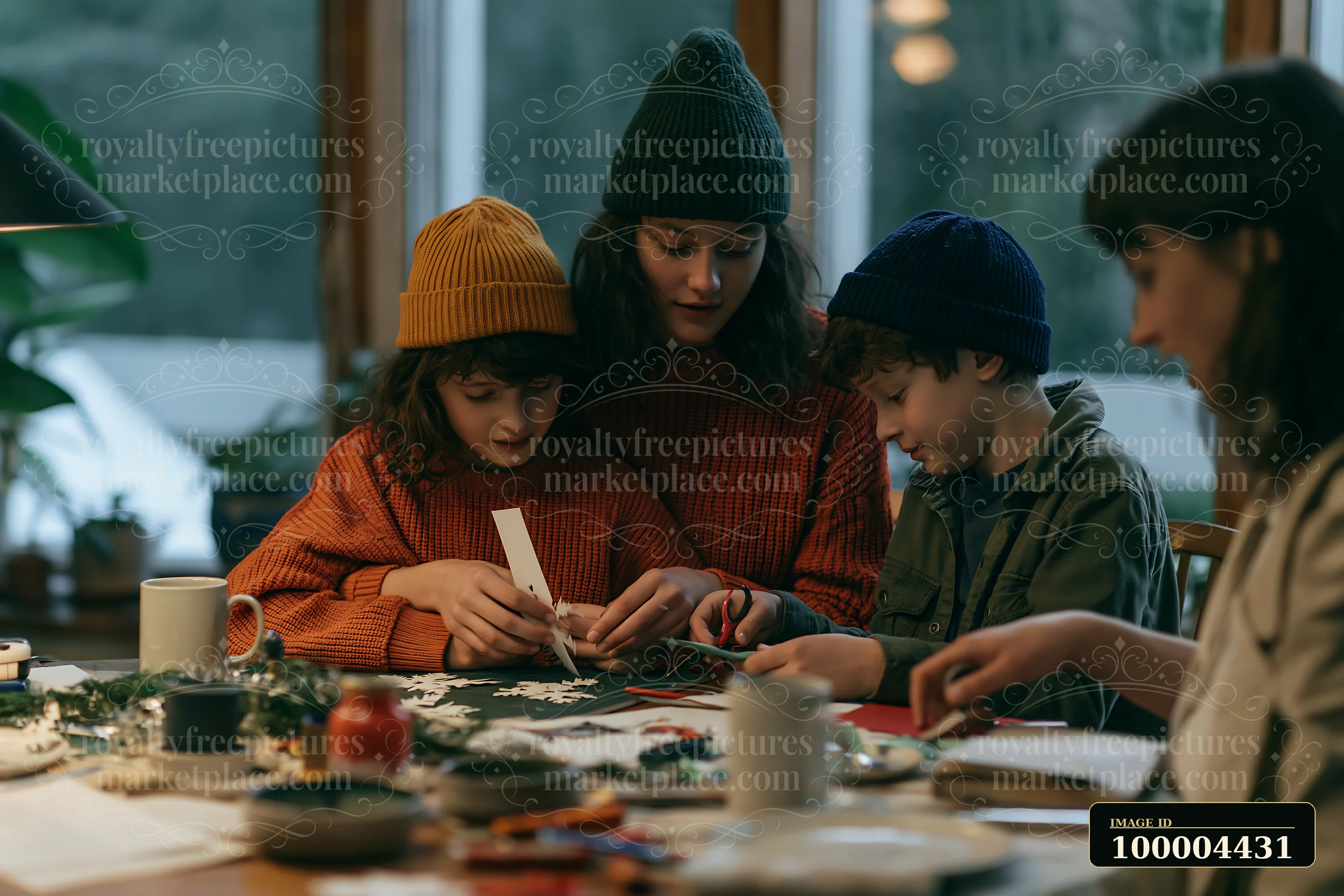 Family members make paper snowflakes together at a warmly lit indoor craft table.