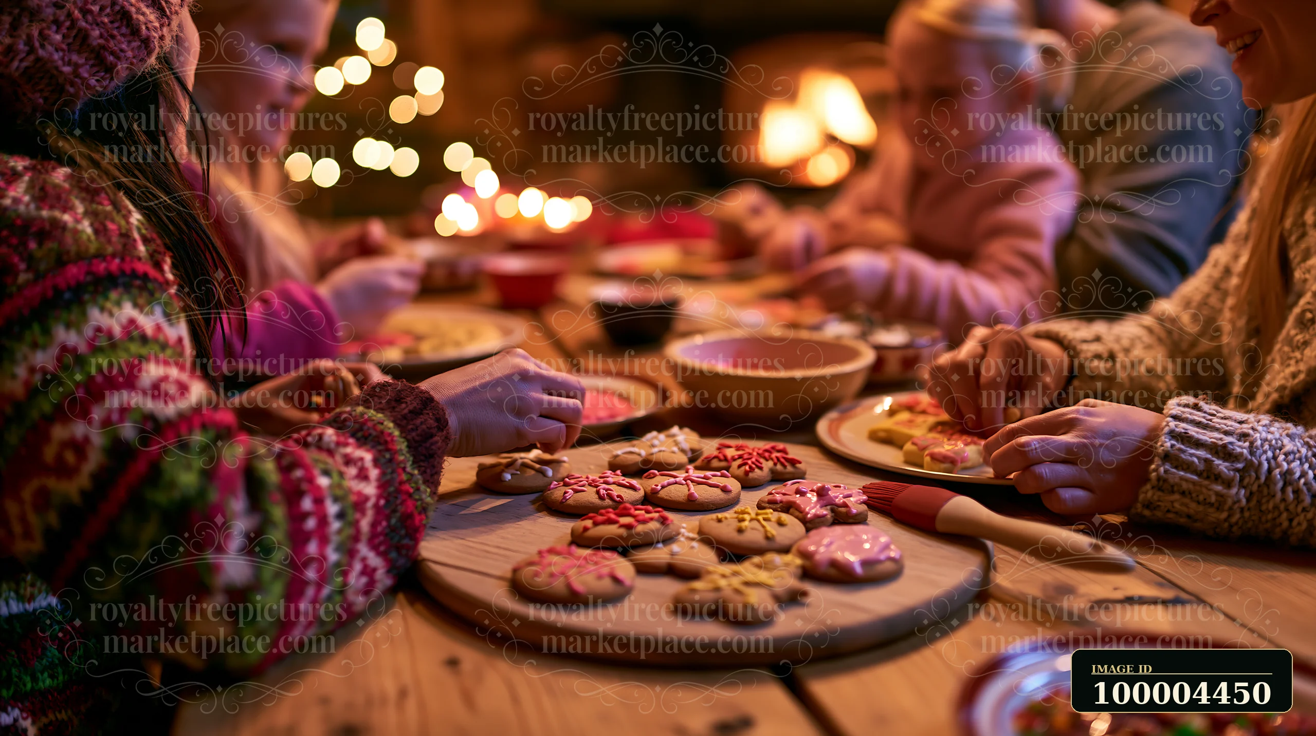 Family members decorate iced cookies together around a warmly lit wooden table.