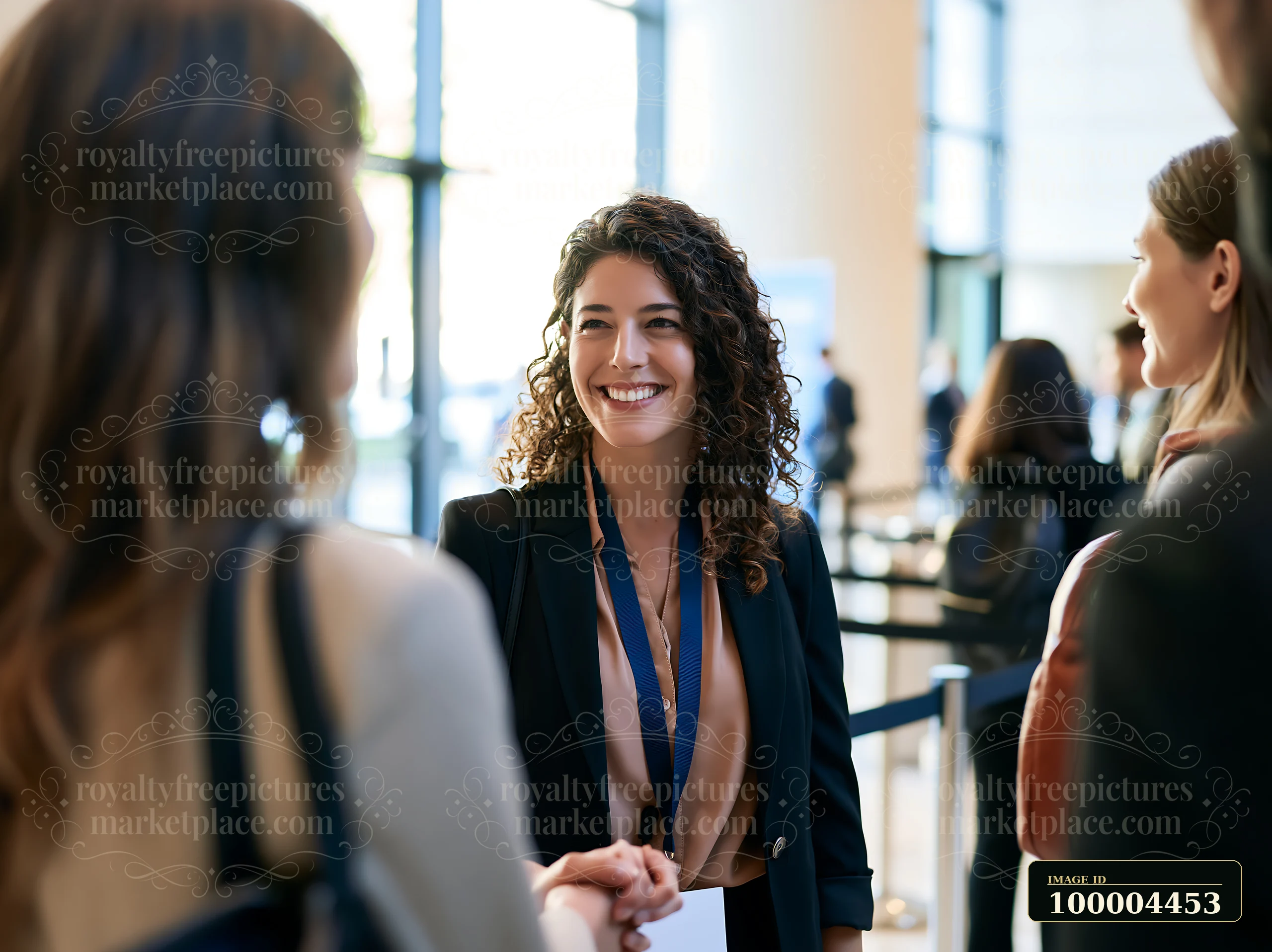 A businesswoman engages in conversation while networking at an industry conference.