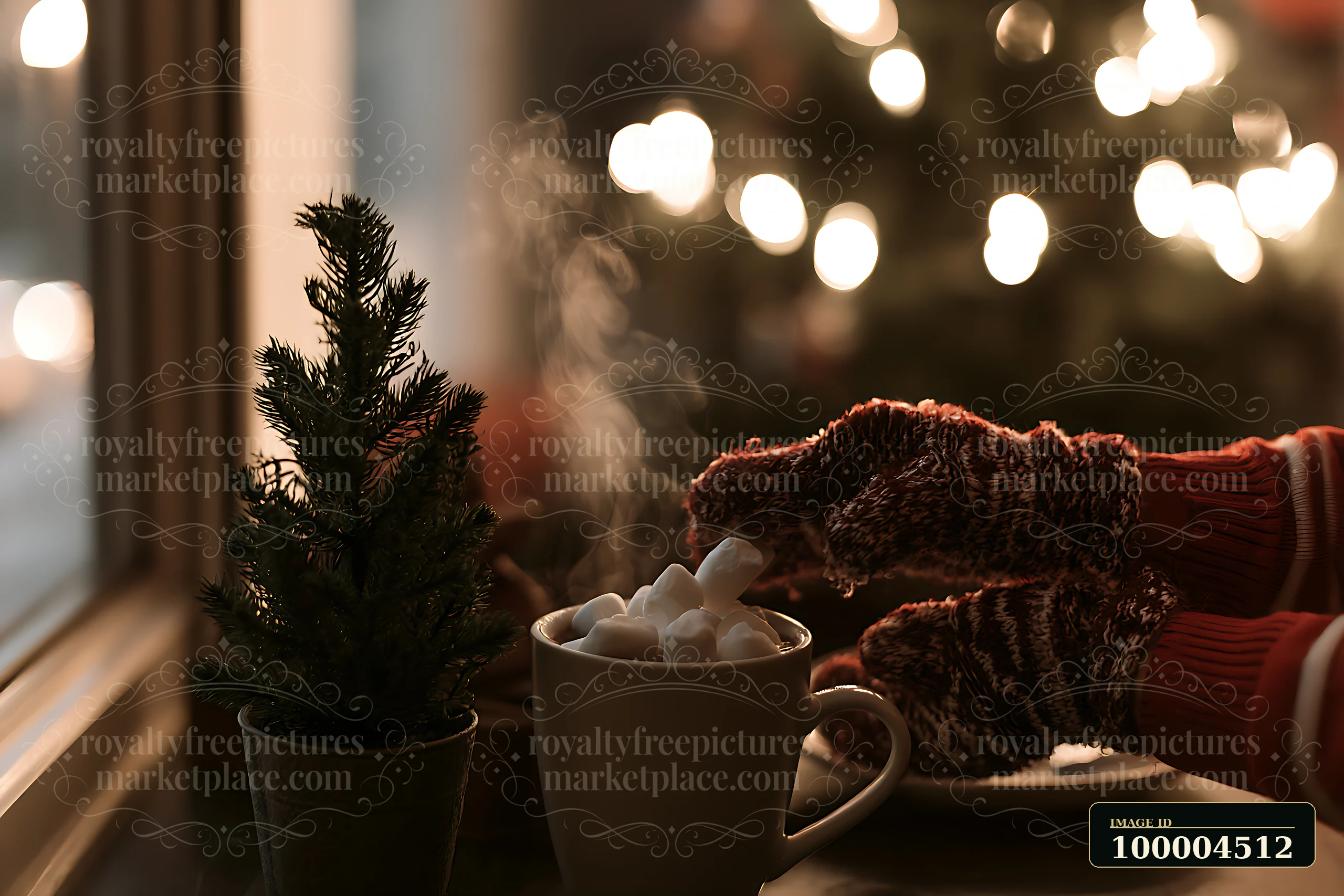 A cup of warm cocoa topped with marshmallows sits on a table near a small tree.