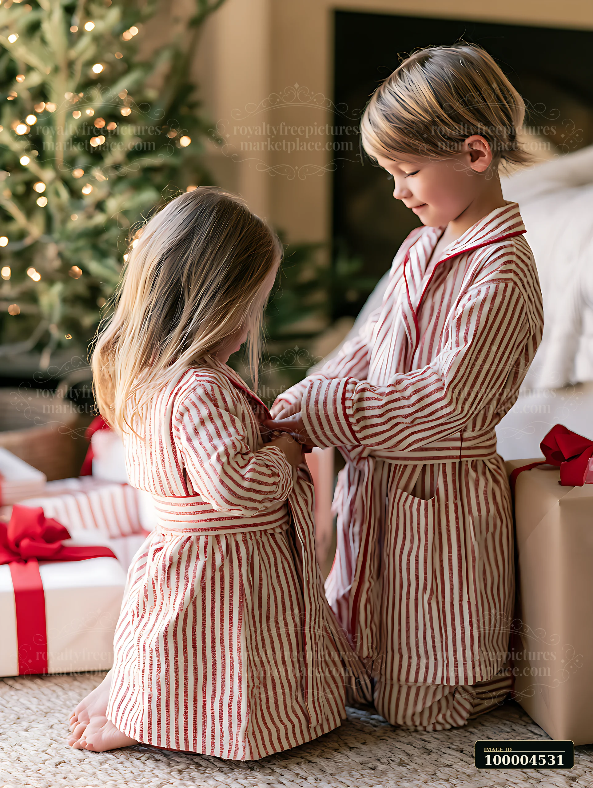 Children wearing matching pajamas open gifts in a cozy living room decorated for Christmas.