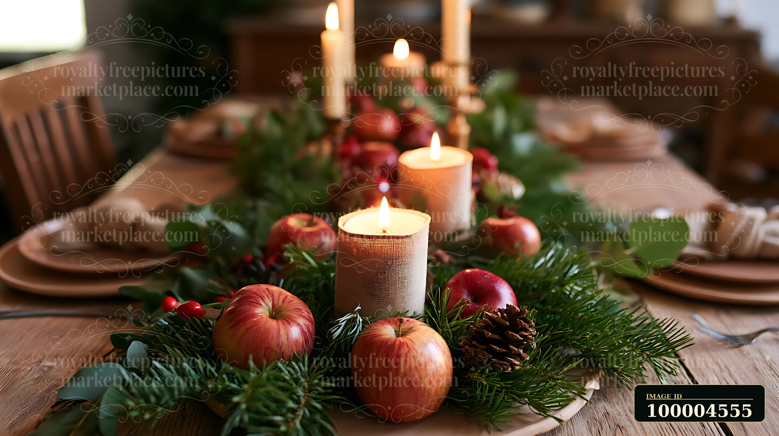 Christmas table centerpiece with lit candles, evergreen greenery, apples, and pine cones, with empty copy space around the arrangement.