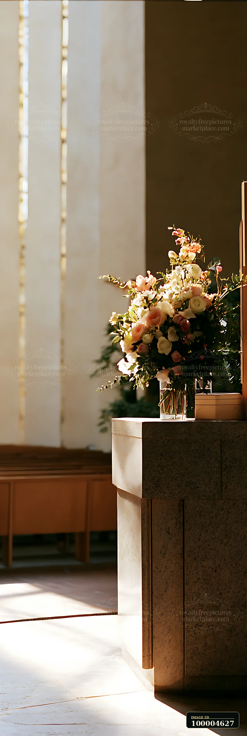 A wedding bouquet is placed on the altar, showcasing beautiful flowers in a brightly lit space.