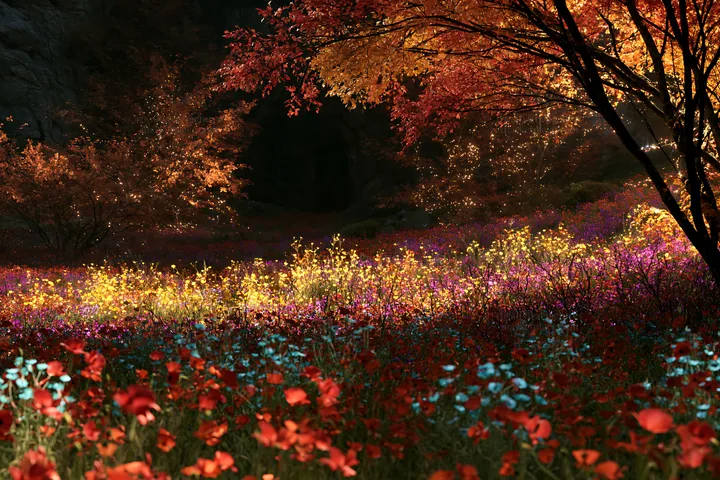 Christmas lights in meadow by cave - AI-generated stock image