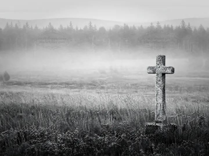 Weathered Christian cross in misty meadow with trees - AI-generated stock image