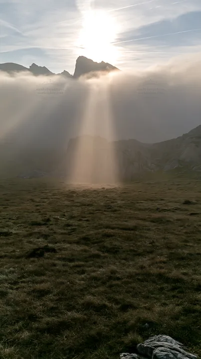 Sunrays shining on Picos de Europa meadow - AI-generated stock image